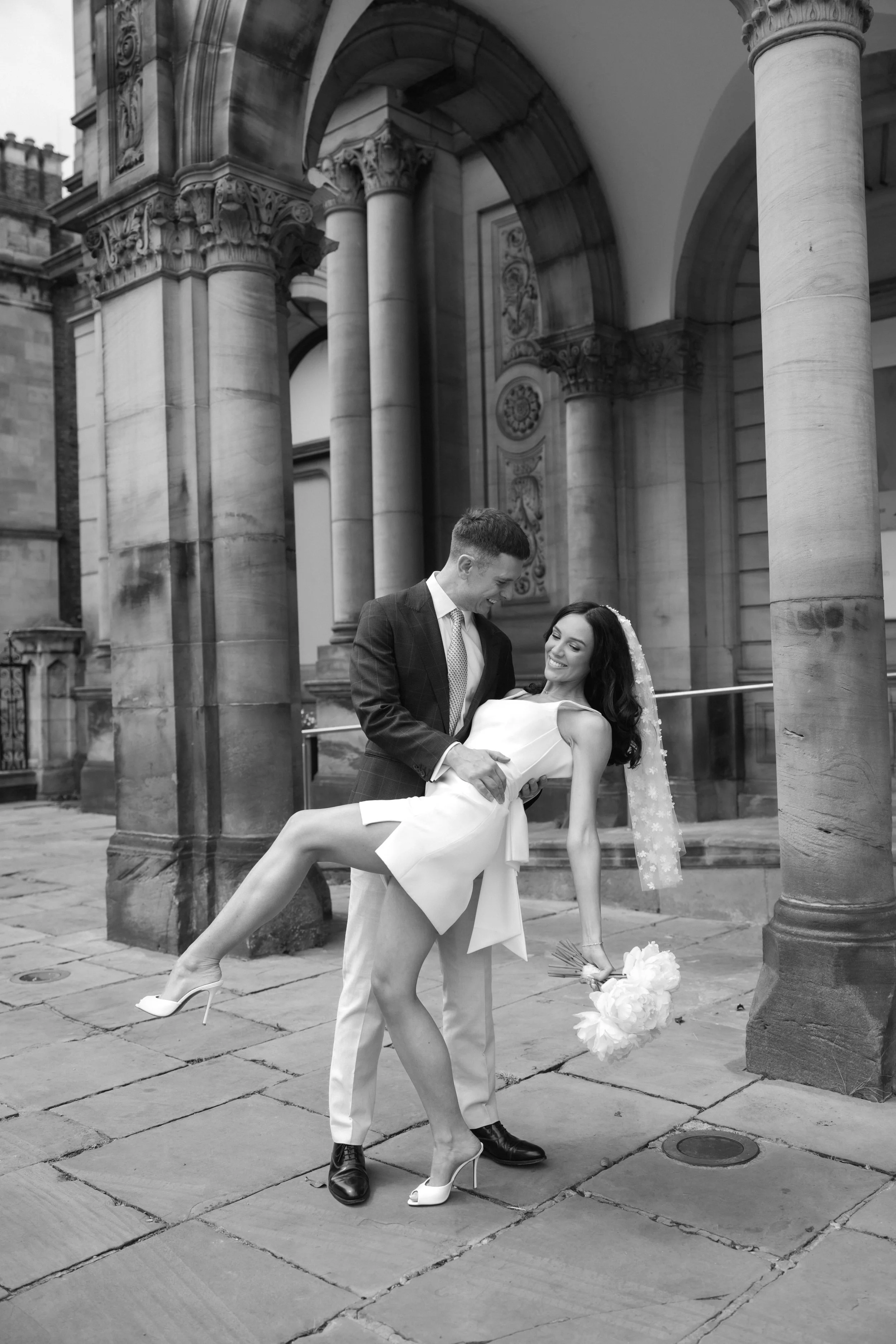 Bride and groom posing for editorial wedding photos in York 