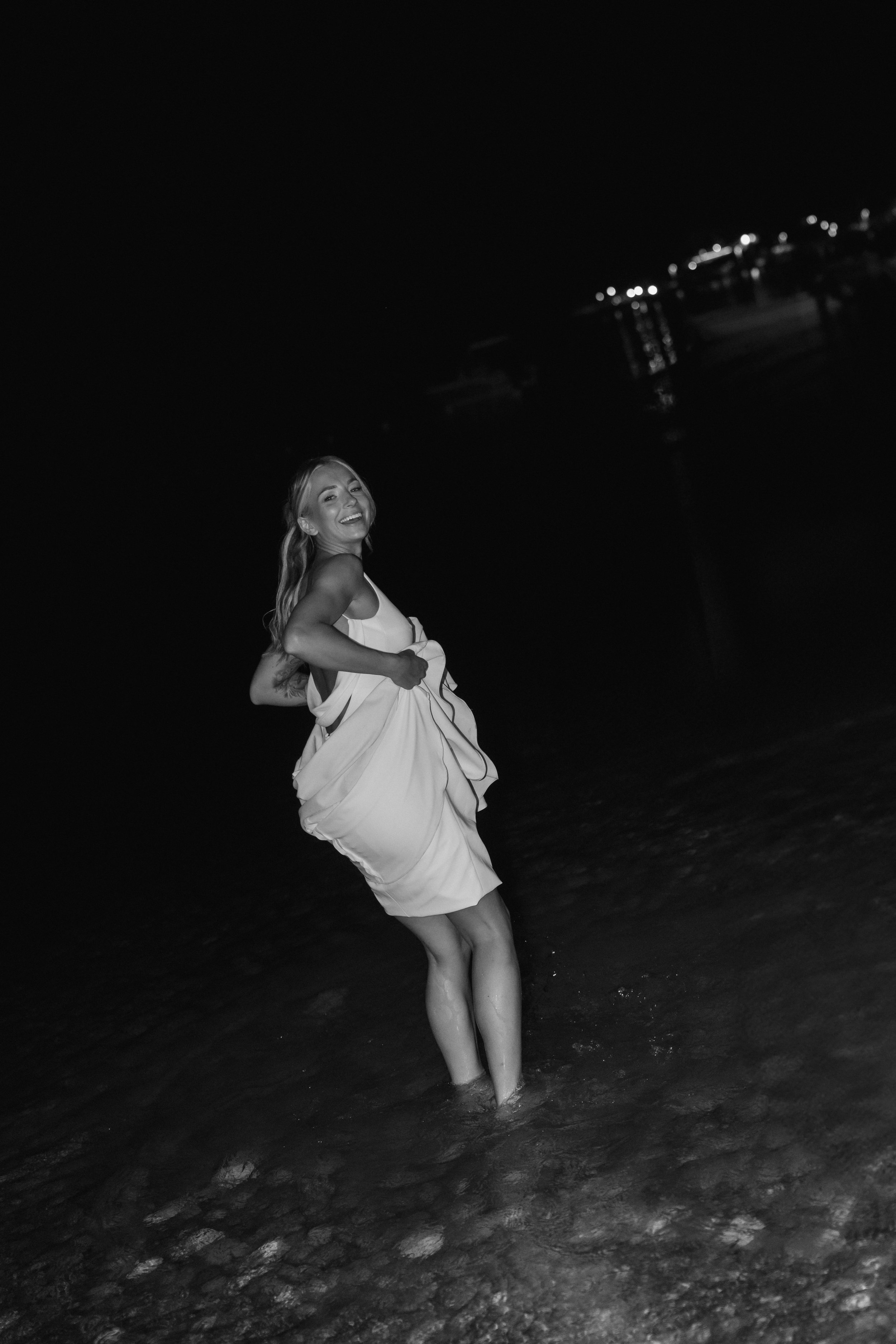 Wedding evening on beach with bride in the sea in Zante, Greece