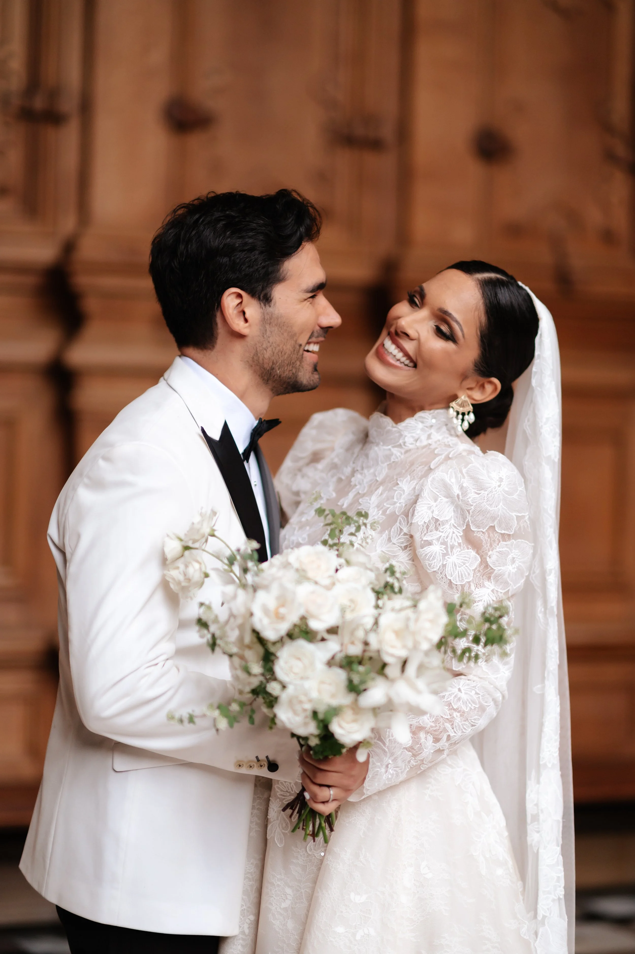 Bride and groom gazing at each other indoors in Harlaxton Manor 