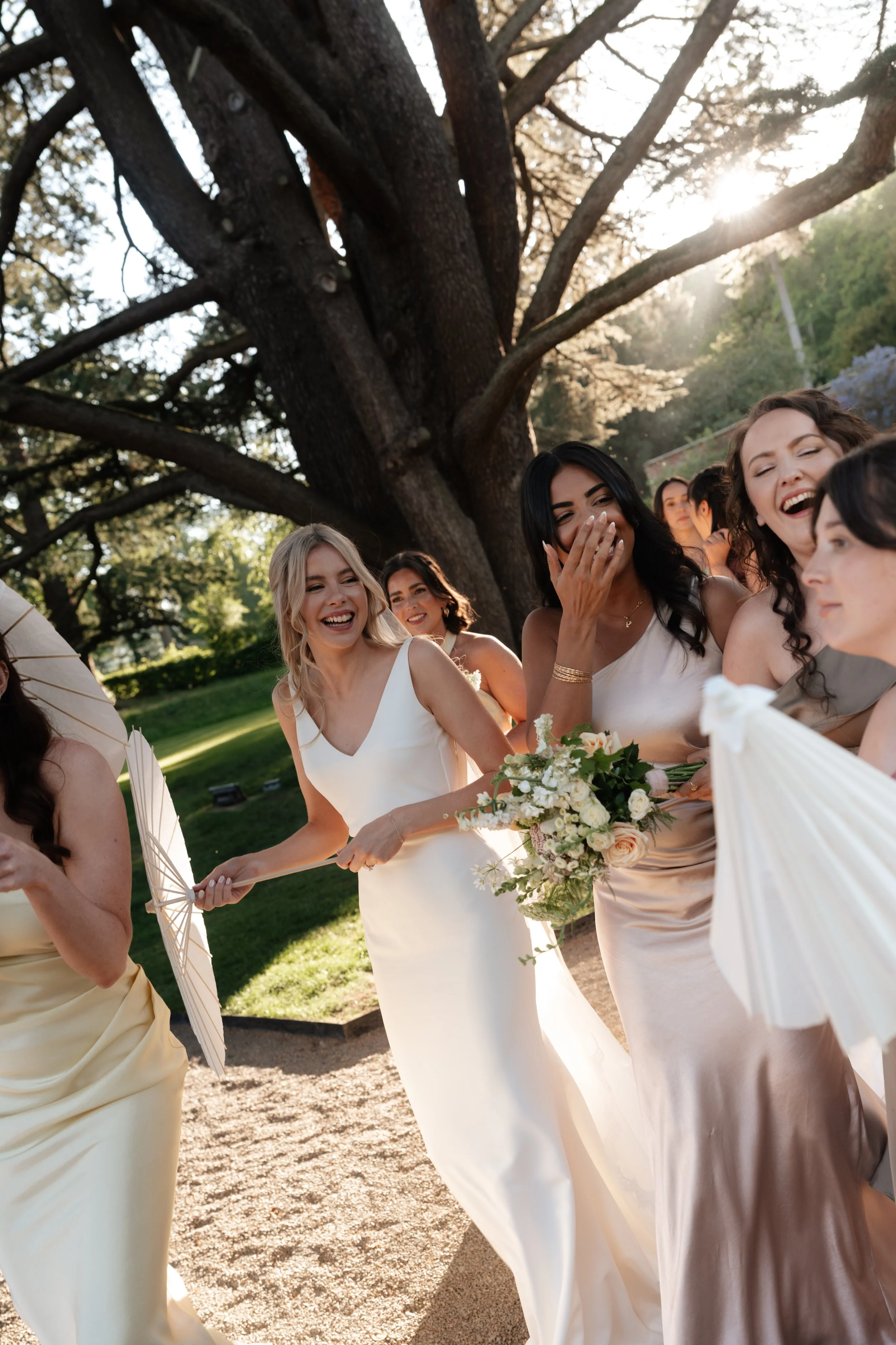 Bride and bridesmaids laughing at Garthmyl Hall 