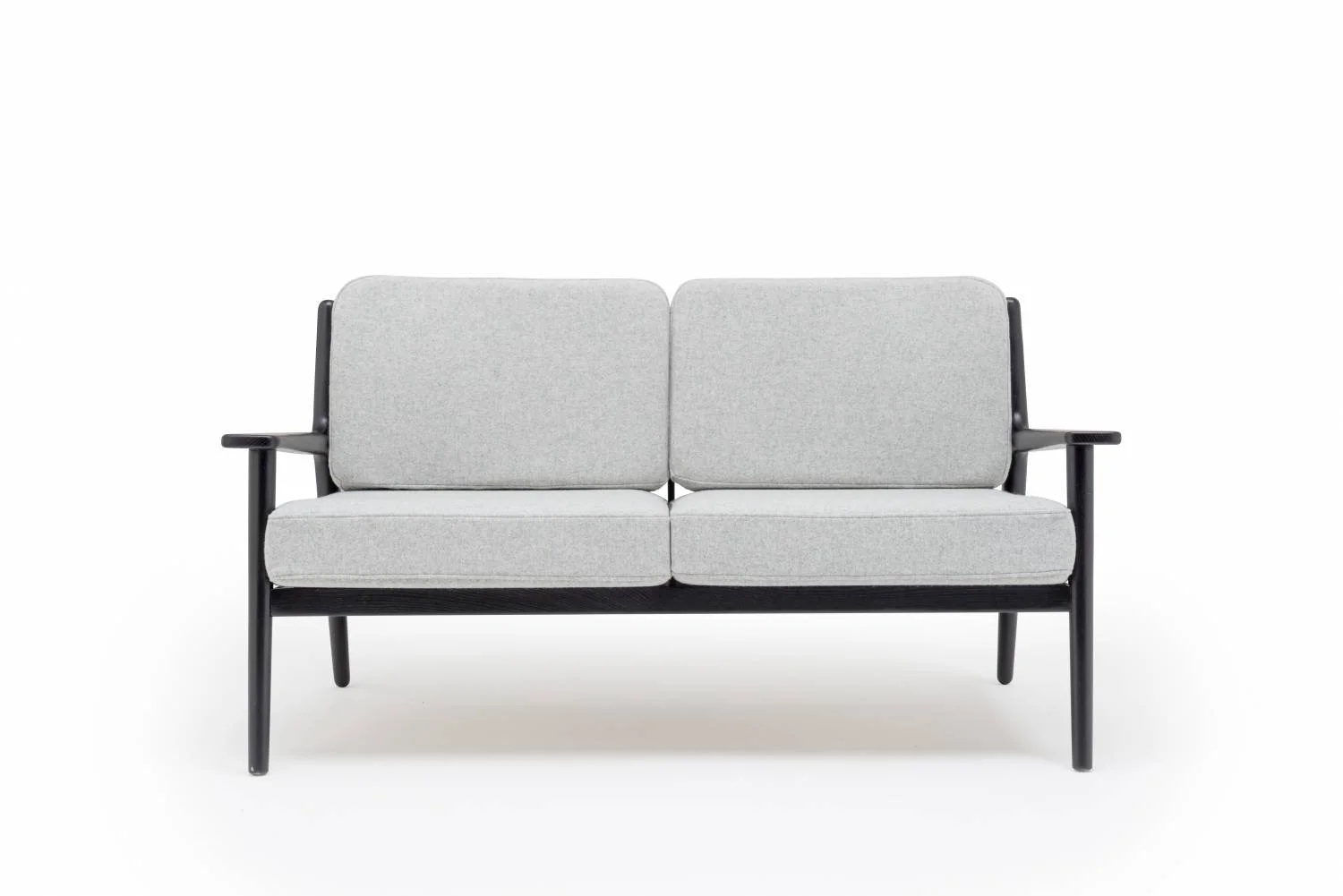 A modern two-seater sofa with light gray fabric cushions and black wooden frame against a white background.
