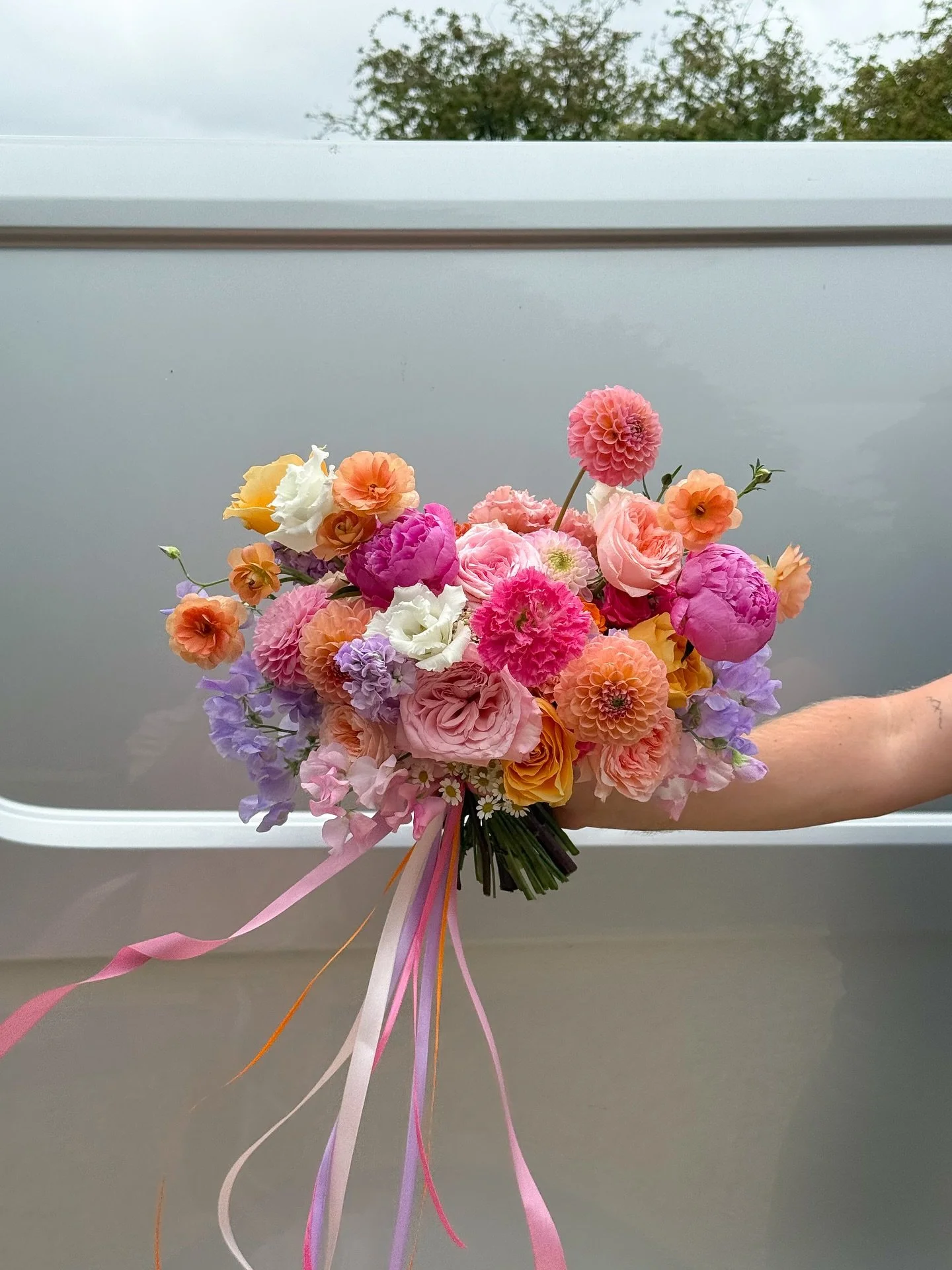 A moment for Olivia&rsquo;s bridal bouquet 😍🌺🍊🍋💜🕊️🌅 #bridalbouquet #weddingflowers #modernwedding