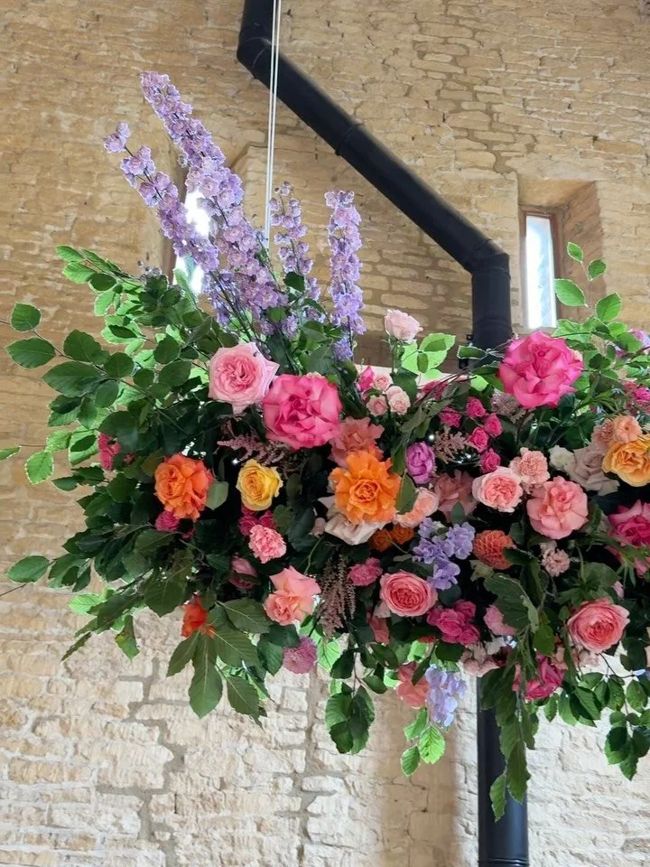 earlier this month we created a gorgey flower cloud for O &amp; S @yardspaceoldgore, the colour palette was inspired by a picture the bride had captured of the most stunning and vibrant sunset 🥹💖🍊💜

#modernflorist #flowercloud #weddingflowers #mo