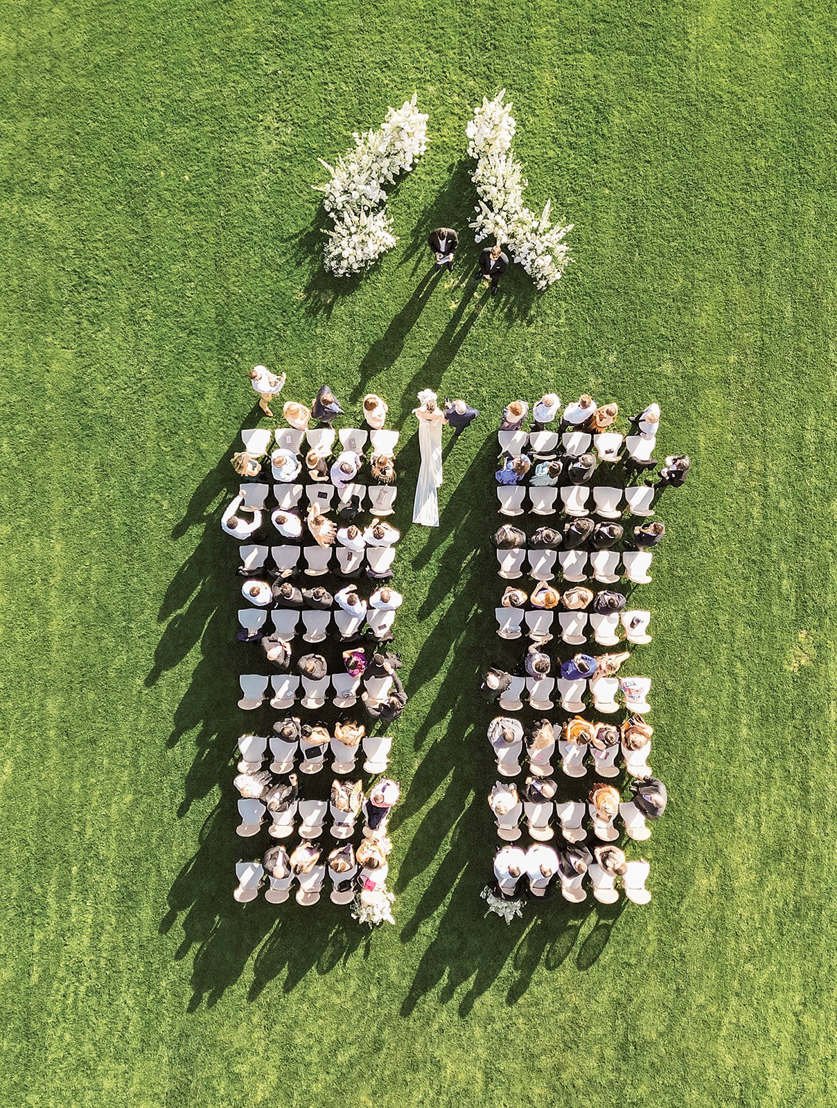 Aerial view of an outdoor luxury wedding ceremony 