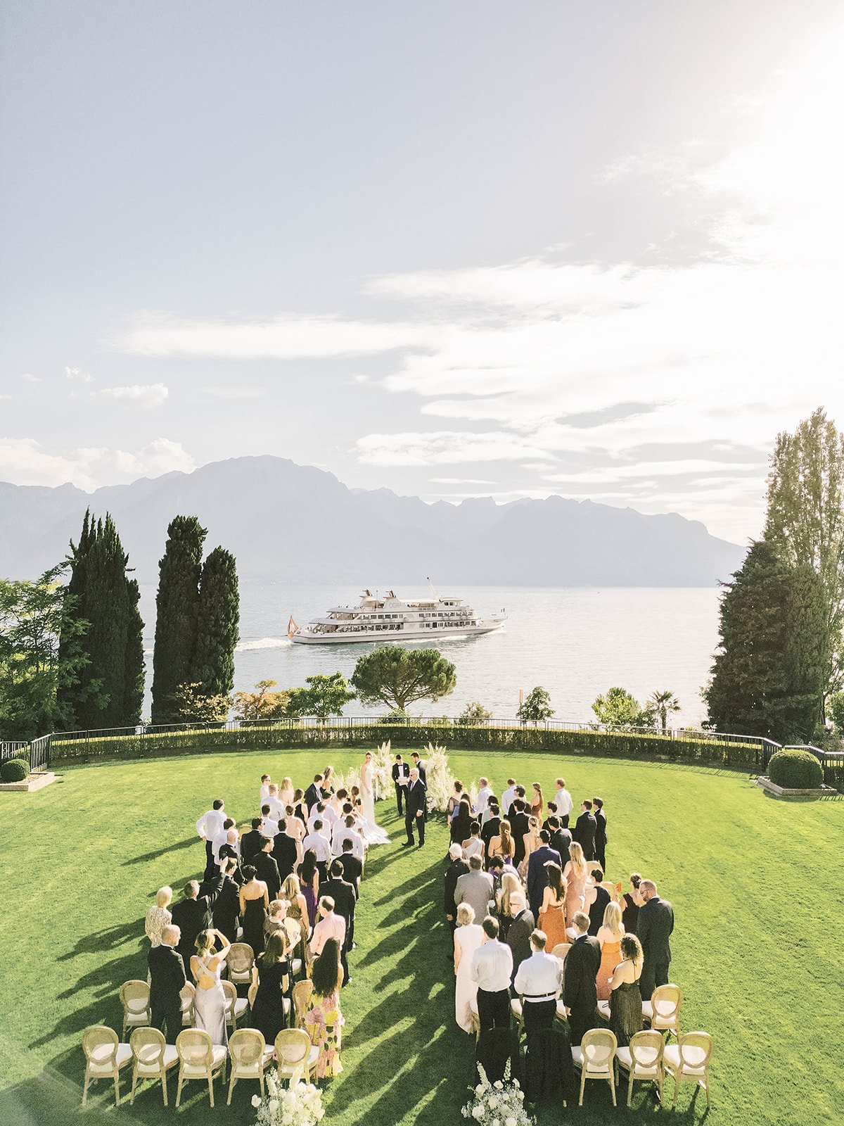 Aerial view of an outdoor luxury wedding ceremony with a lake view in Montreux