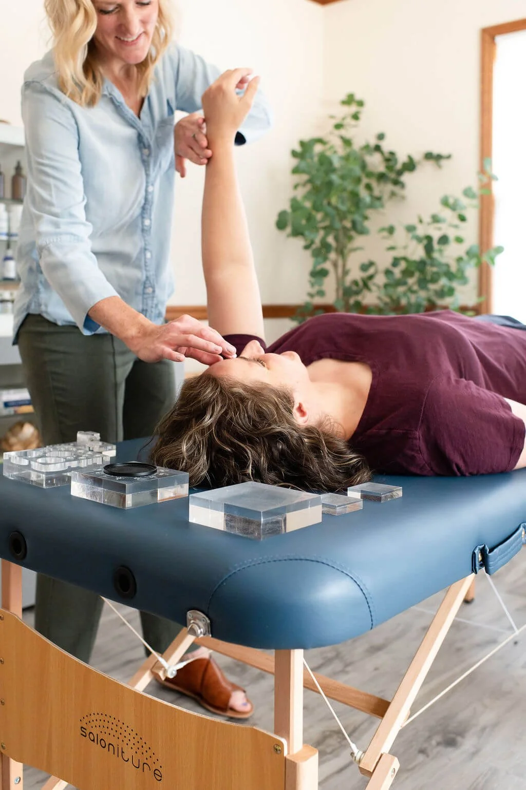Caitlin Samson performs autonomic response testing for a client at True Food and Wellness
