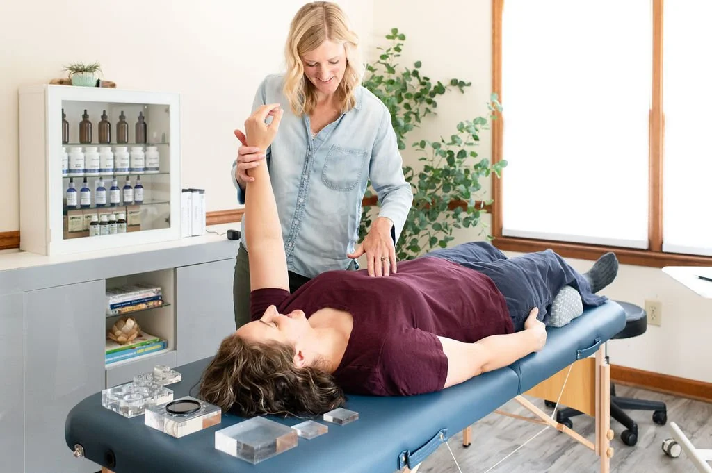 Caitlin Samson performs ART on a client at True Food and Wellness in Smyrna GA