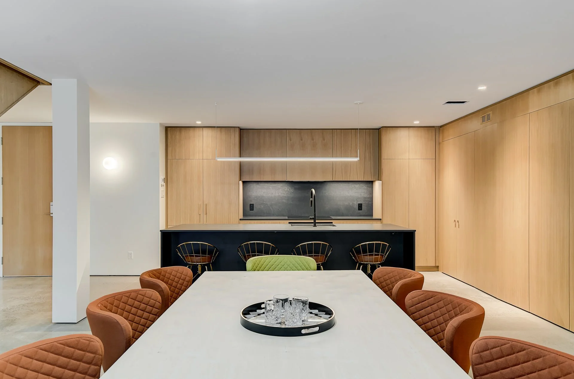 Modern kitchen and dining area giving out to english garden