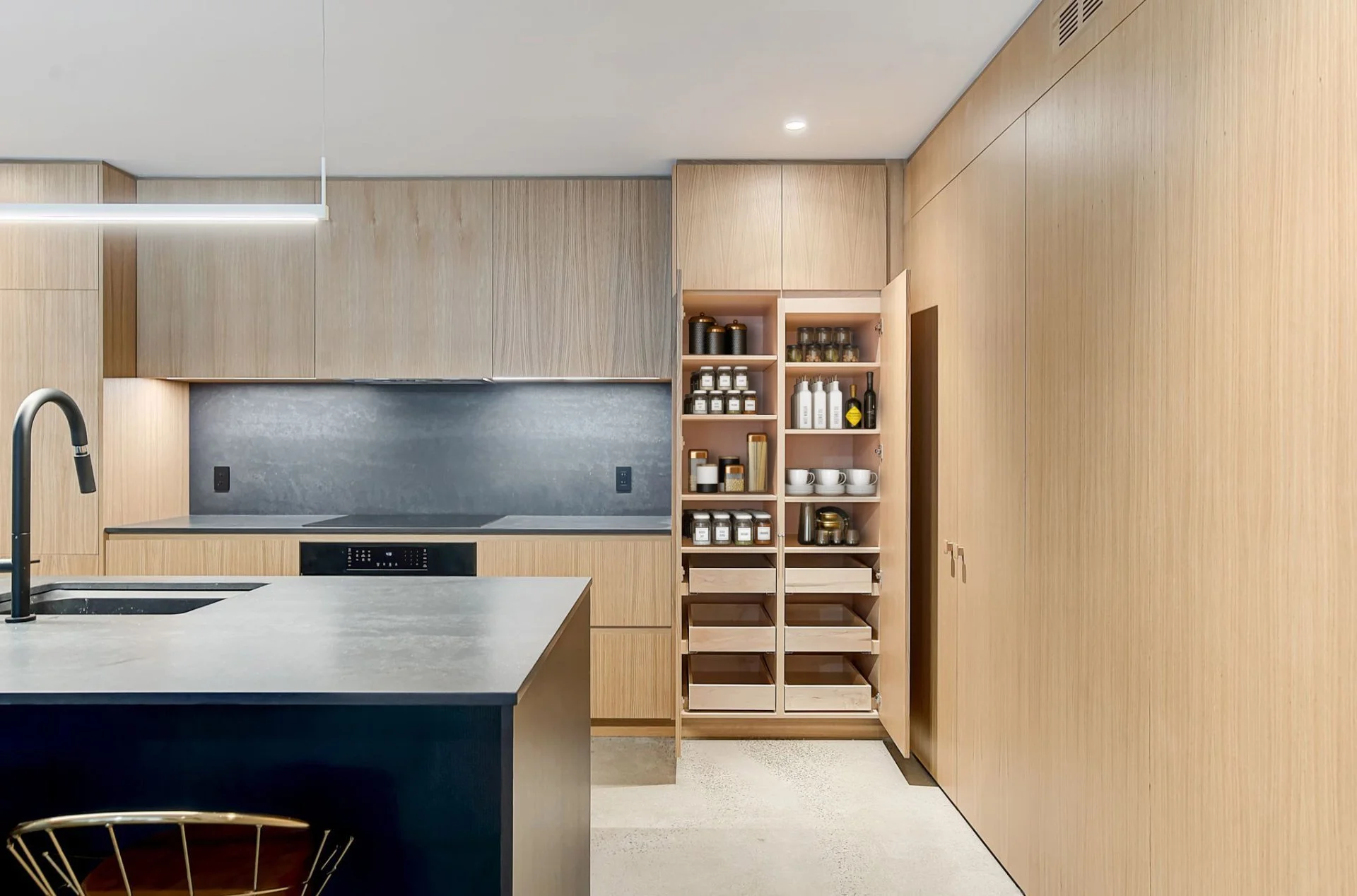 Modern kitchen and dining area giving out to english garden