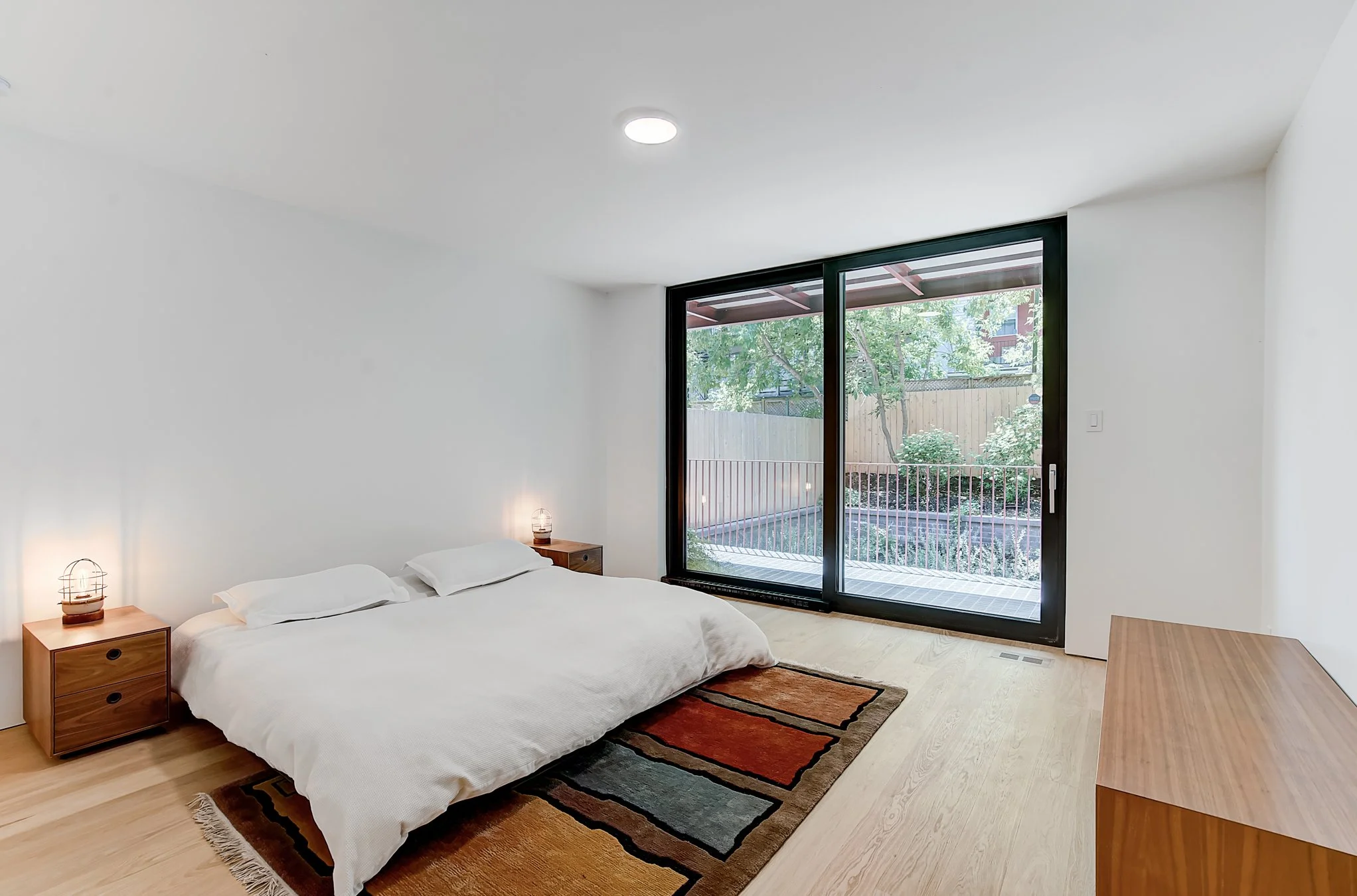 Minimalist bedroom giving out to excavated english garden