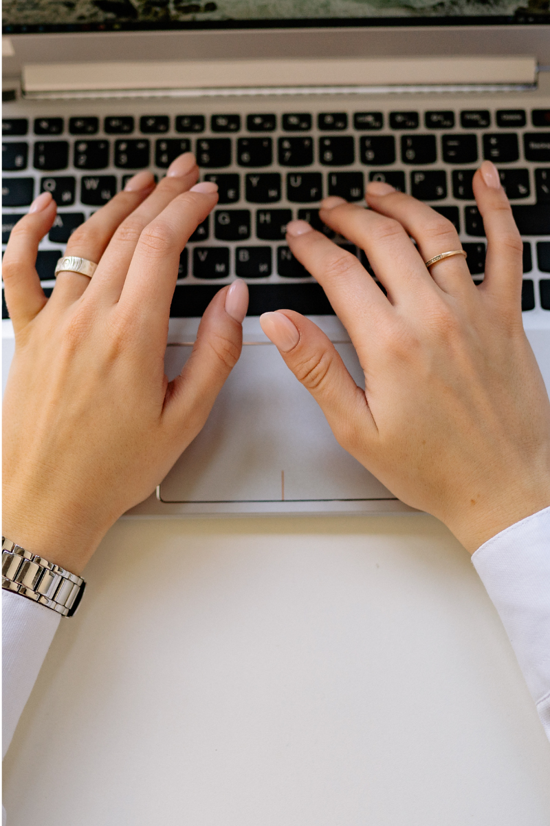 person typing on a laptop