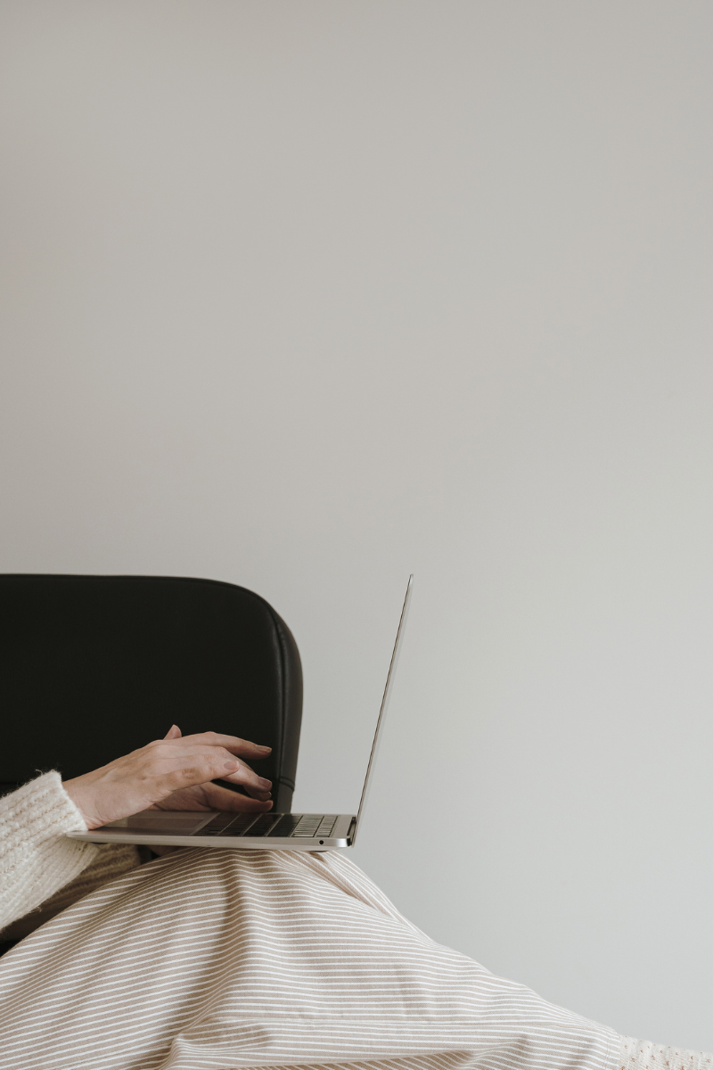 someone typing on a laptop