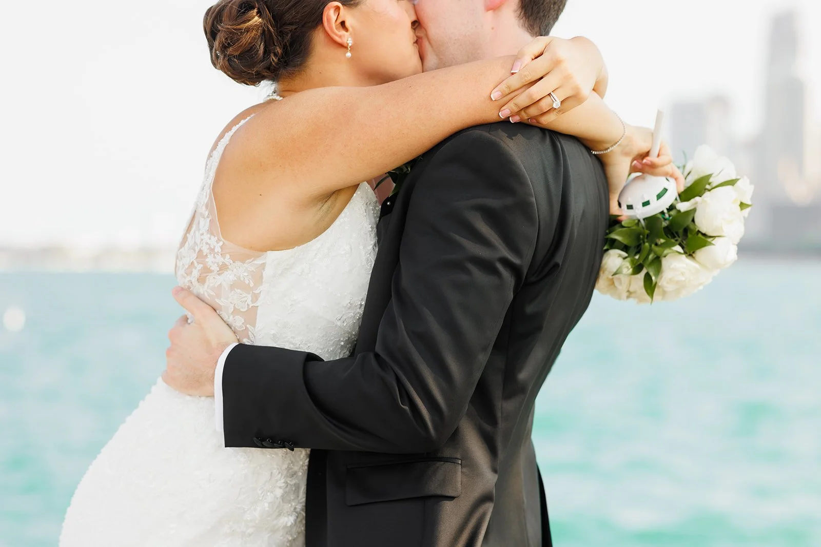 Bride holding bouquet with city skyline in background – Houston wedding photographer – Wild Ivy Creative Photography