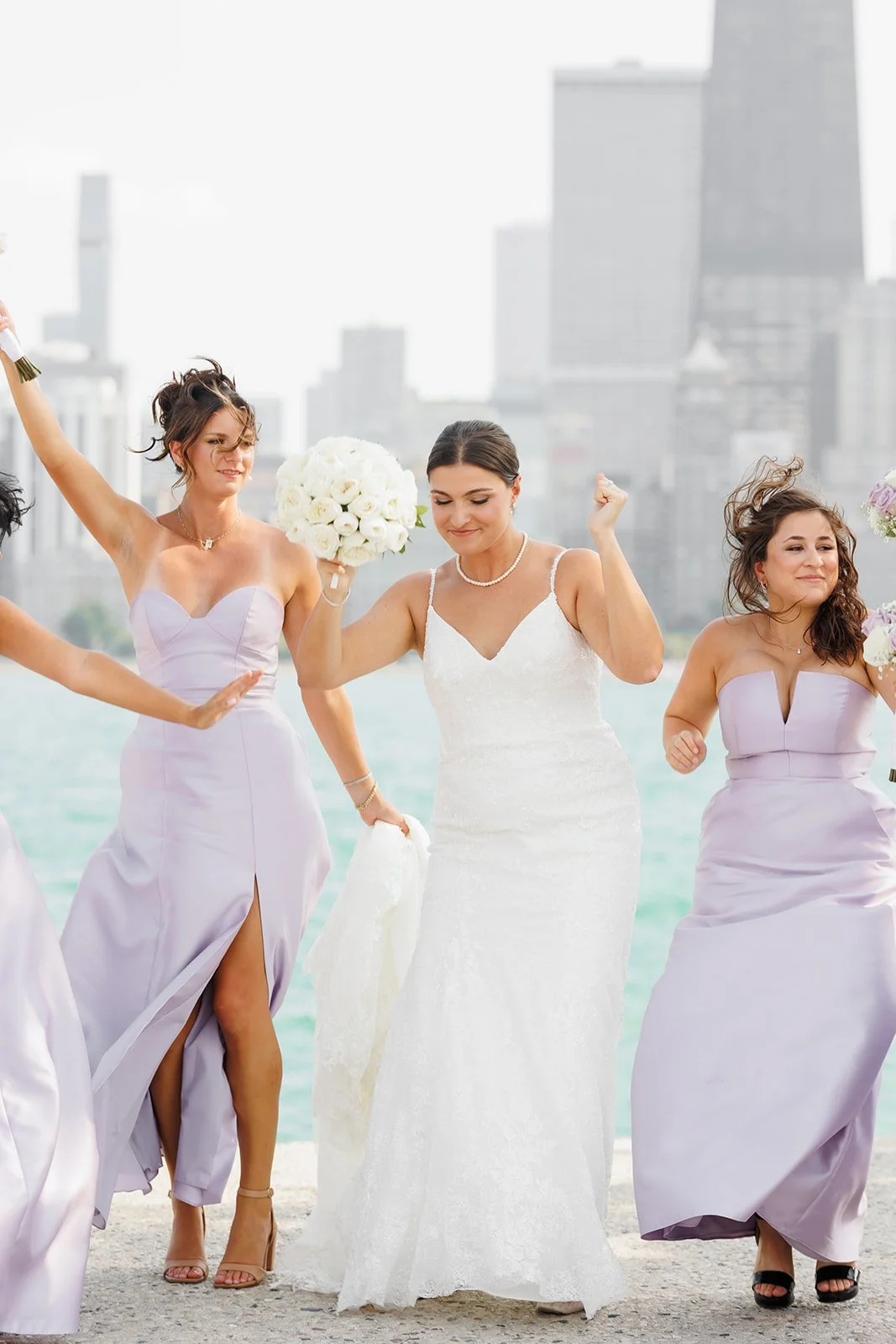 Bride laughing with wind in her hair with city skyline – The Woodlands wedding photographer – Wild Ivy Creative Photography