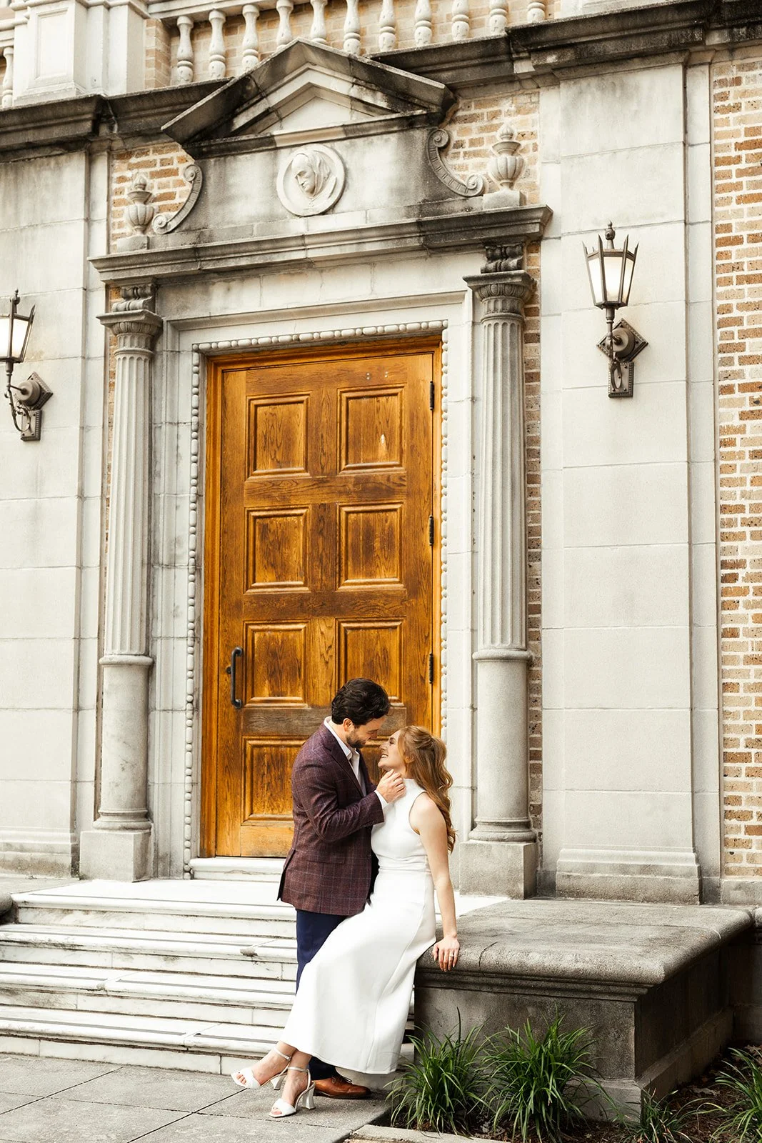 Downtown Houston engagement session in the courtyard at Julia Ideson Building captured by top rated Houston engagement photographer Wild Ivy Creative Photography. Perfect inspiration for couples planning elegant engagement photos in Houston.