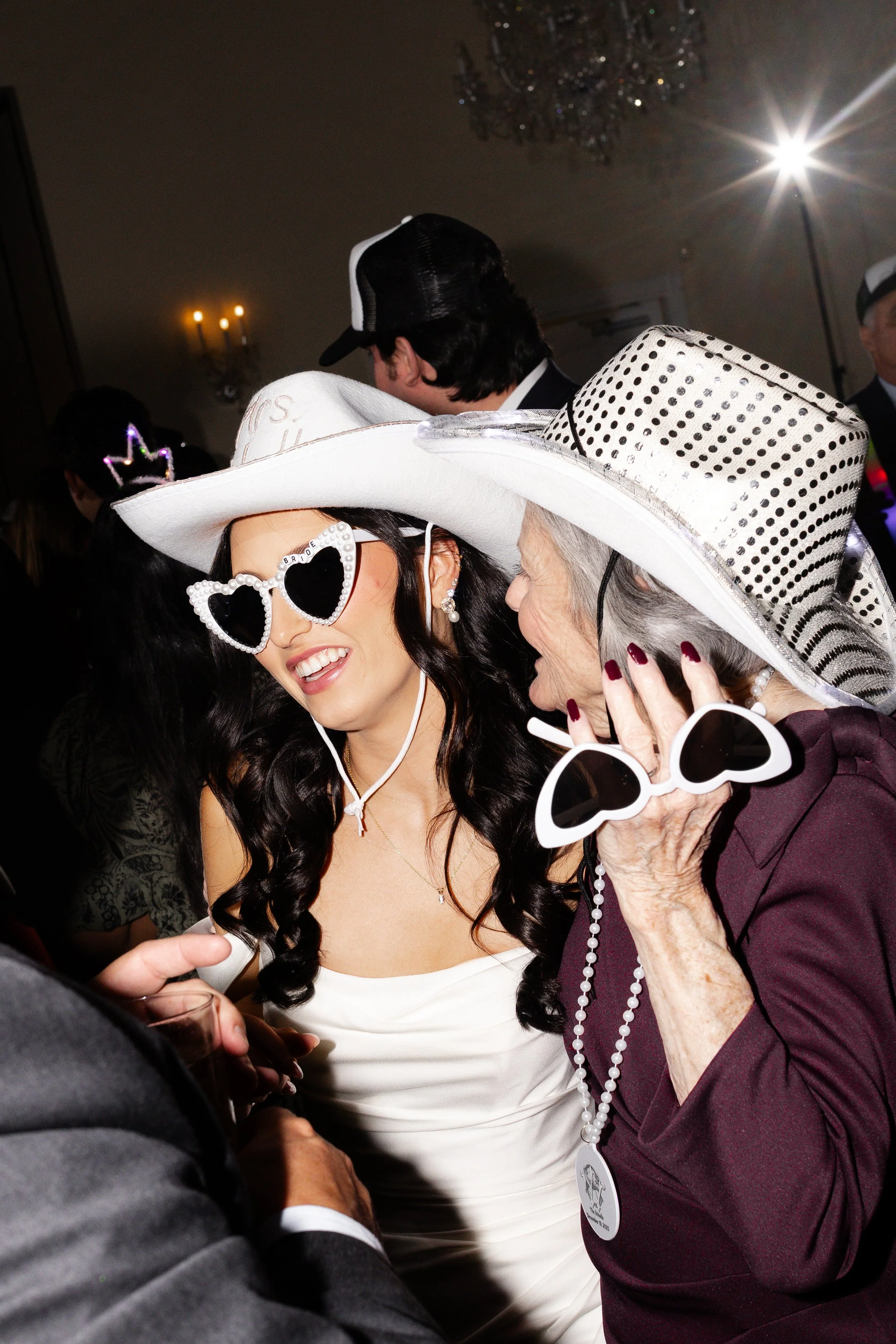 Bride and friends celebrating after an elegant and timeless wedding at the Ashton Gardens Wedding Venue in Houston, captured by Wild Ivy Creative Photography