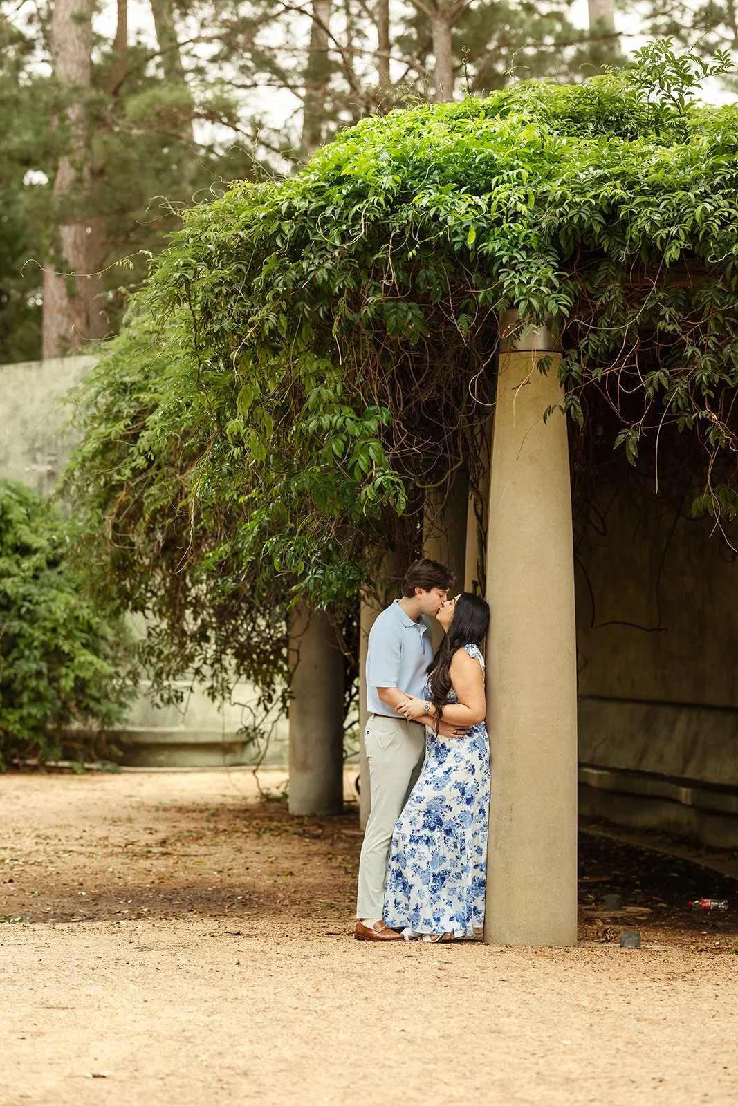 Couple interacting at Hermann Park during their engagement photoshoot with renowned Houston Photographer Wild Ivy Creative