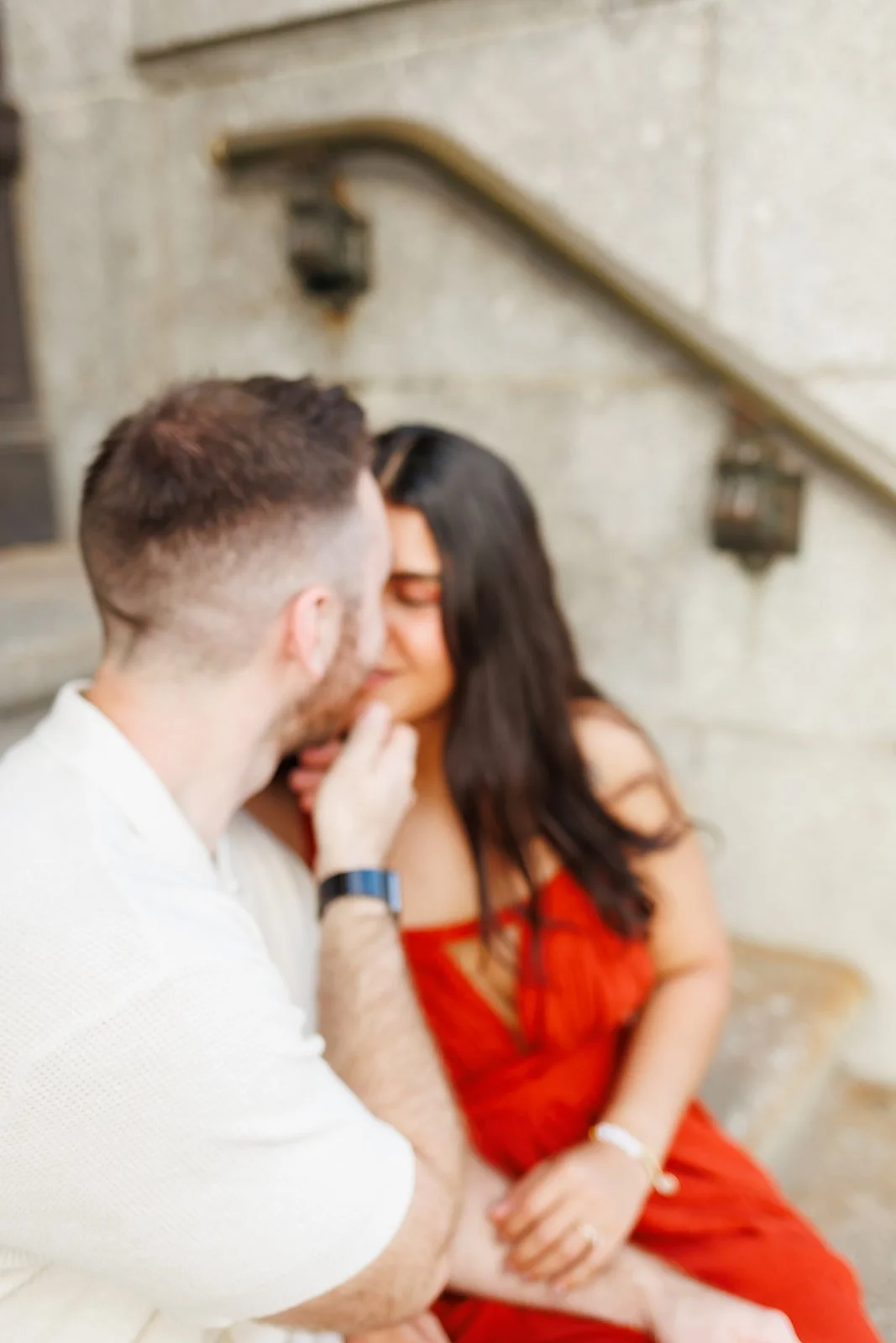 Emotional and romantic Houston engagement session with a couple sharing a quiet moment on stone steps — photographed by Wild Ivy Creative.