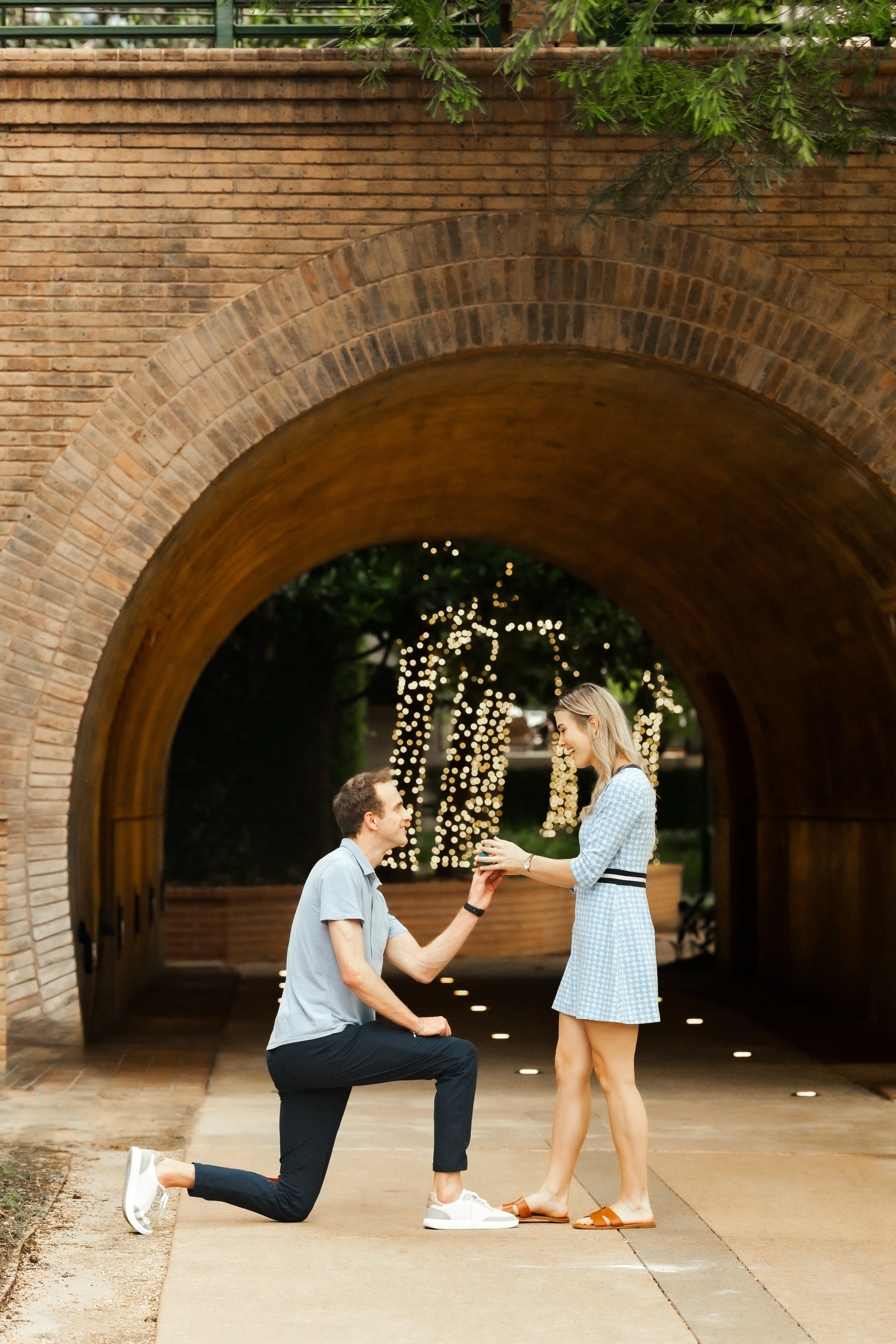 A proposal on the path of the Woodlands Waterway, the couple is filled with joy as she says yes and accepts the ring. The moment is photographed by top rated proposal photographer Wild Ivy Creative