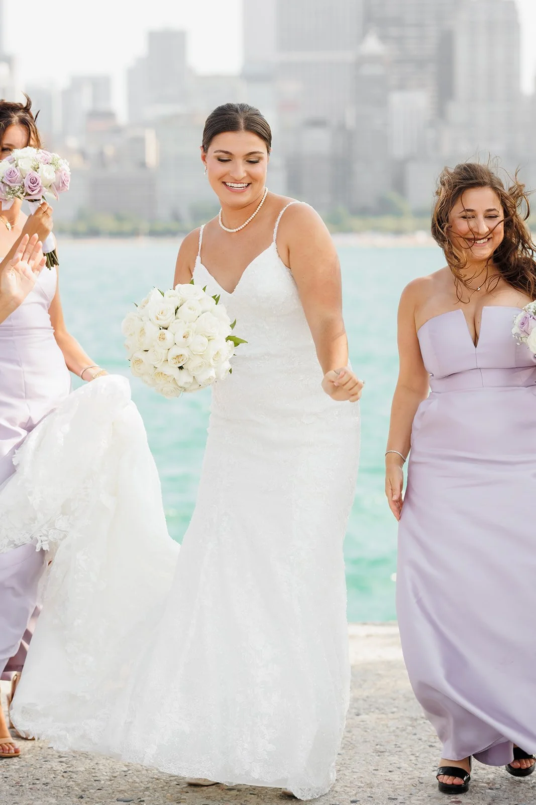 Bride and bridesmaids dancing and having fun during formal portraits in Downtown Houston Wedding with photographer Wild Ivy Creative Photography