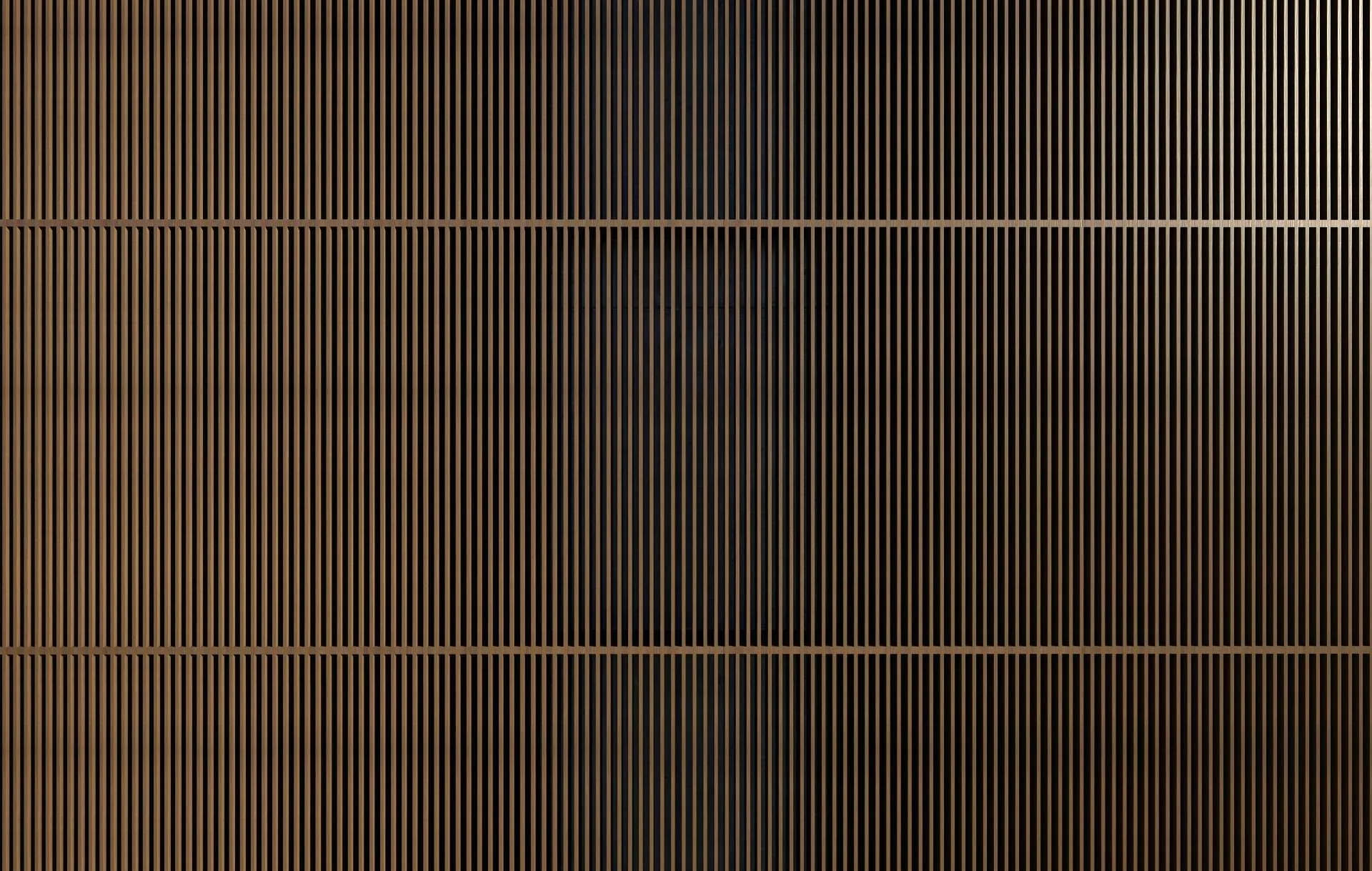 Close-up of a modern speaker grill with vertical black and brown stripes.