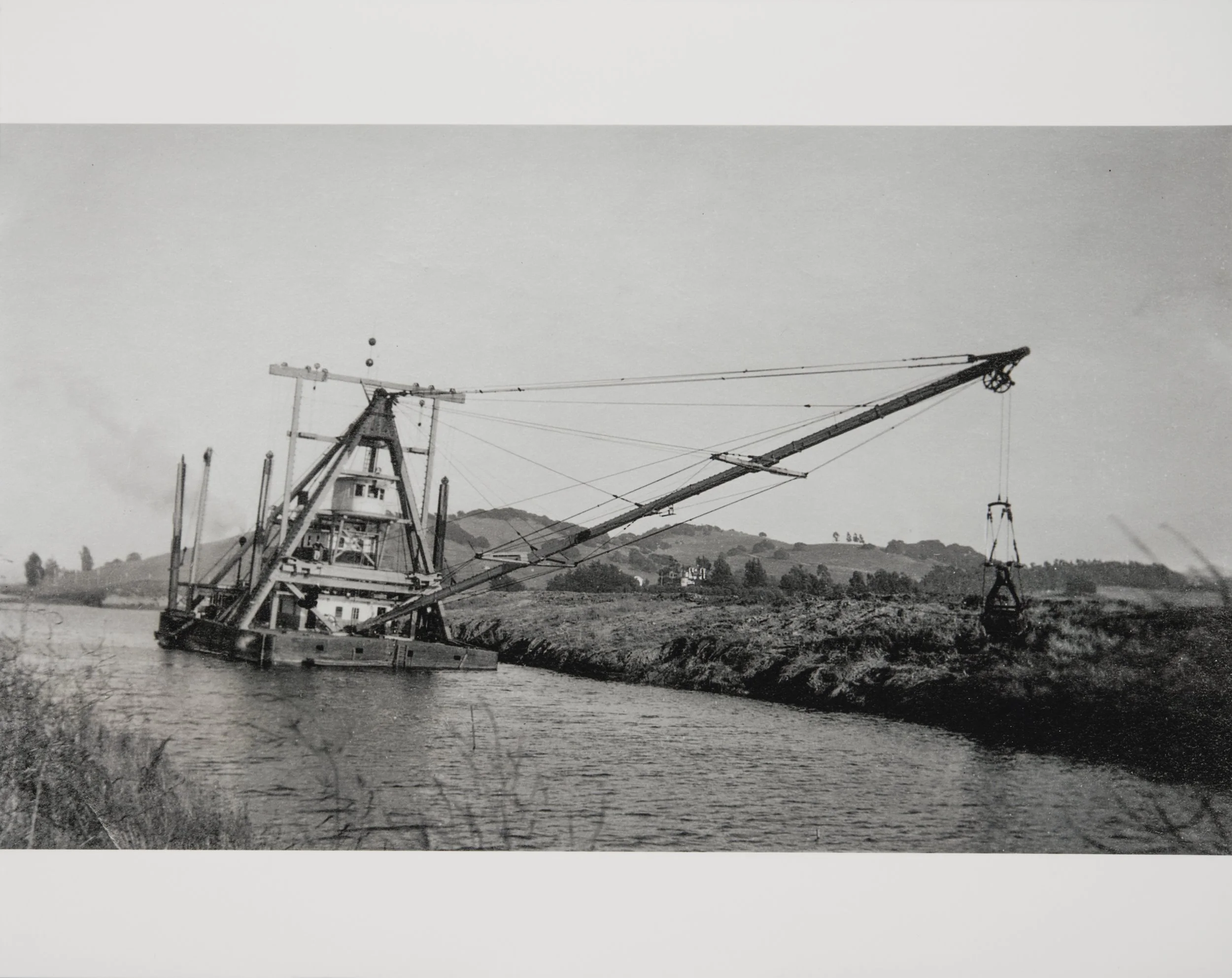 Dredge on the Petaluma River. The tidal nature of this waterway requires constant attention to silt buildup, so dredging is required maintenance. (1920s)