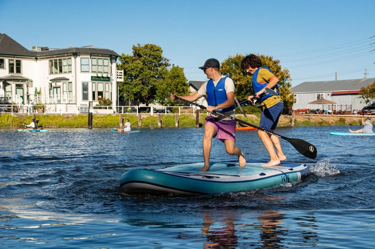 Kids will play on water, no matter what! Teens maneuver The Floathouse's Megalodon giant paddle board (2022)