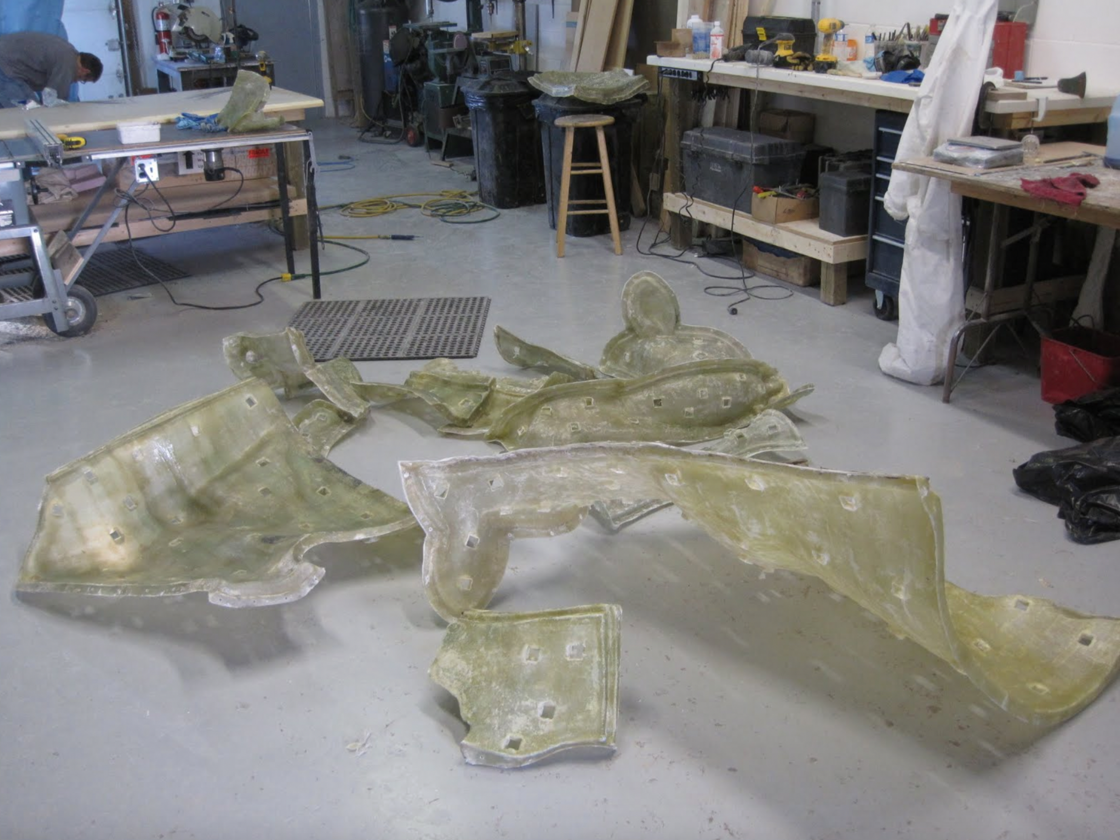  A portion of the 23 pieces of fiberglass jacket that will support the rubber portion of the Holstein mold. Highly detailed copies of the original sculpture can now be produced in fiberglass. These will be the basis for the Holstein dystocia simulato