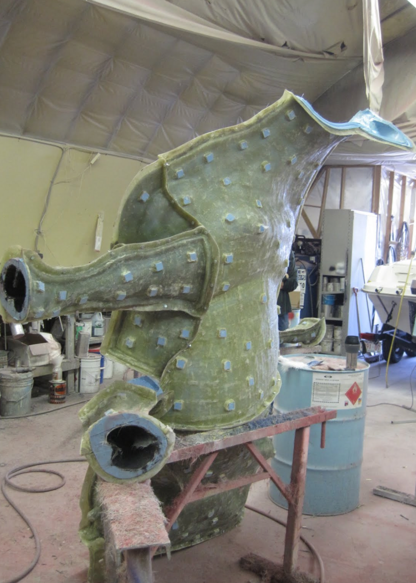 Another view of the Holstein mold during the fiberglass lay-up process.