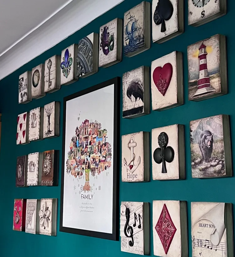 A framed wall of Sid Dickens Memory Blocks on a teal wall