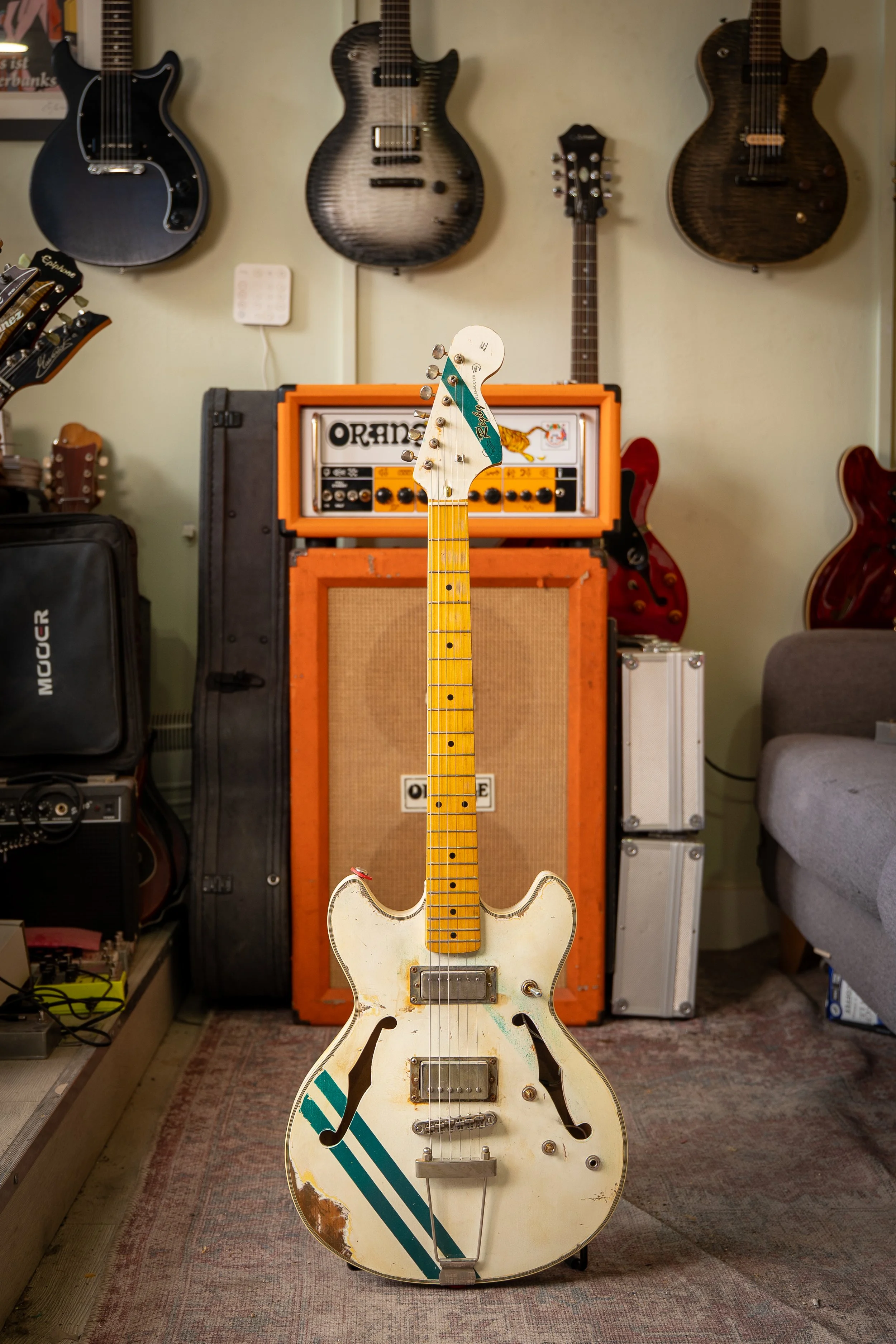 double cutaway hollow body, white with green go faster stripe, maple neck and matching headstock