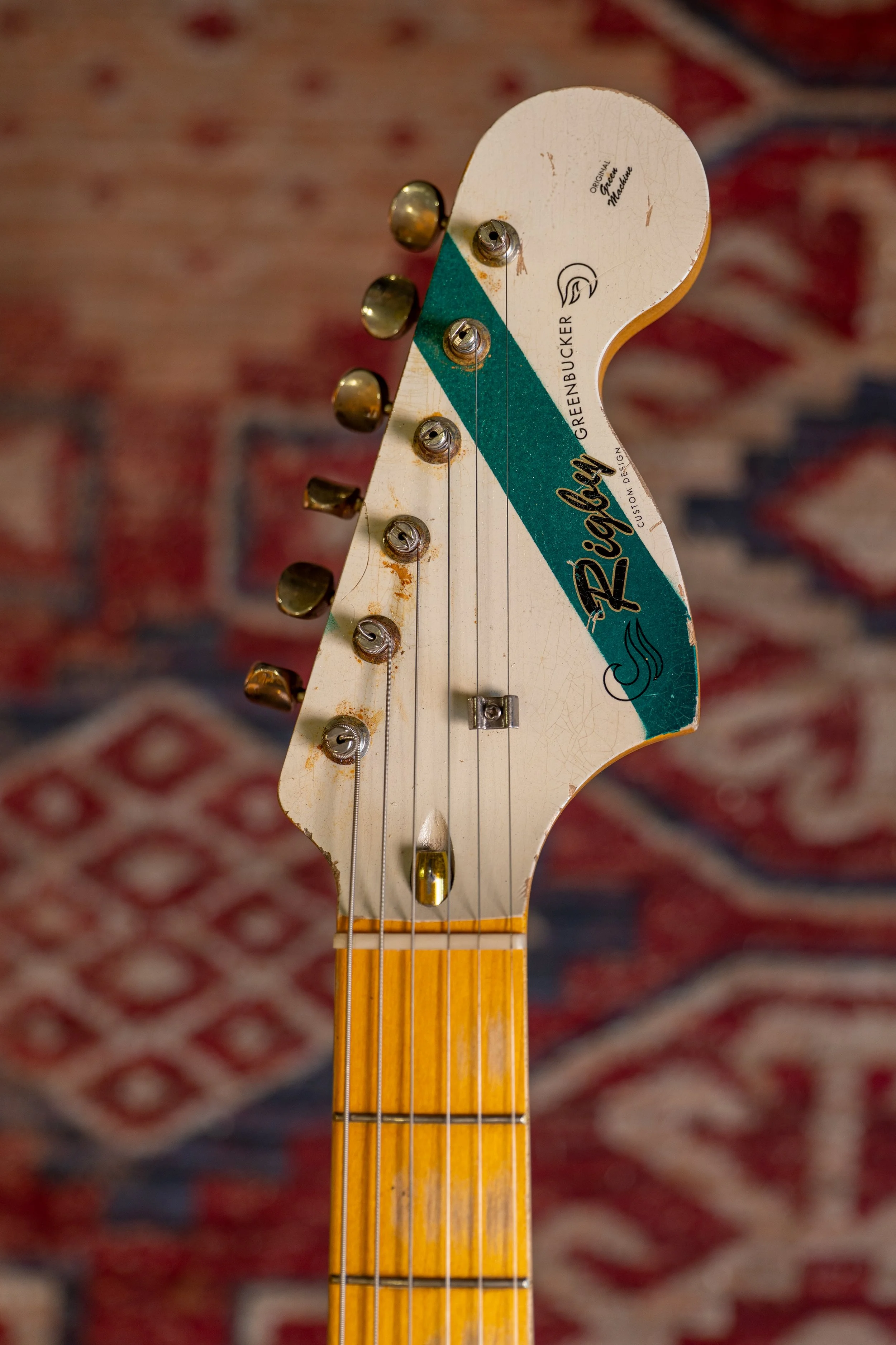 double cutaway hollow body, white with green go faster stripe, maple neck and matching headstock