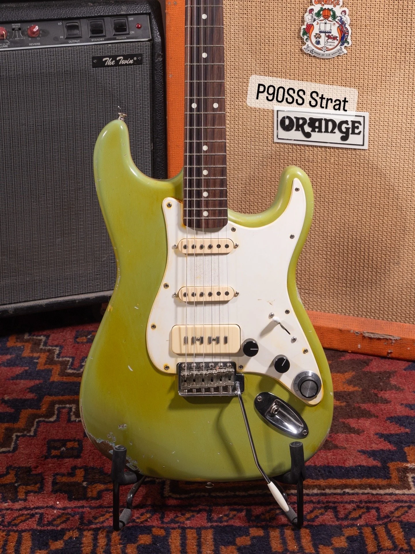 Green HSS Stratocaster with white pickguard reliced with black control knobs, trem arm and yellowed greens pickups