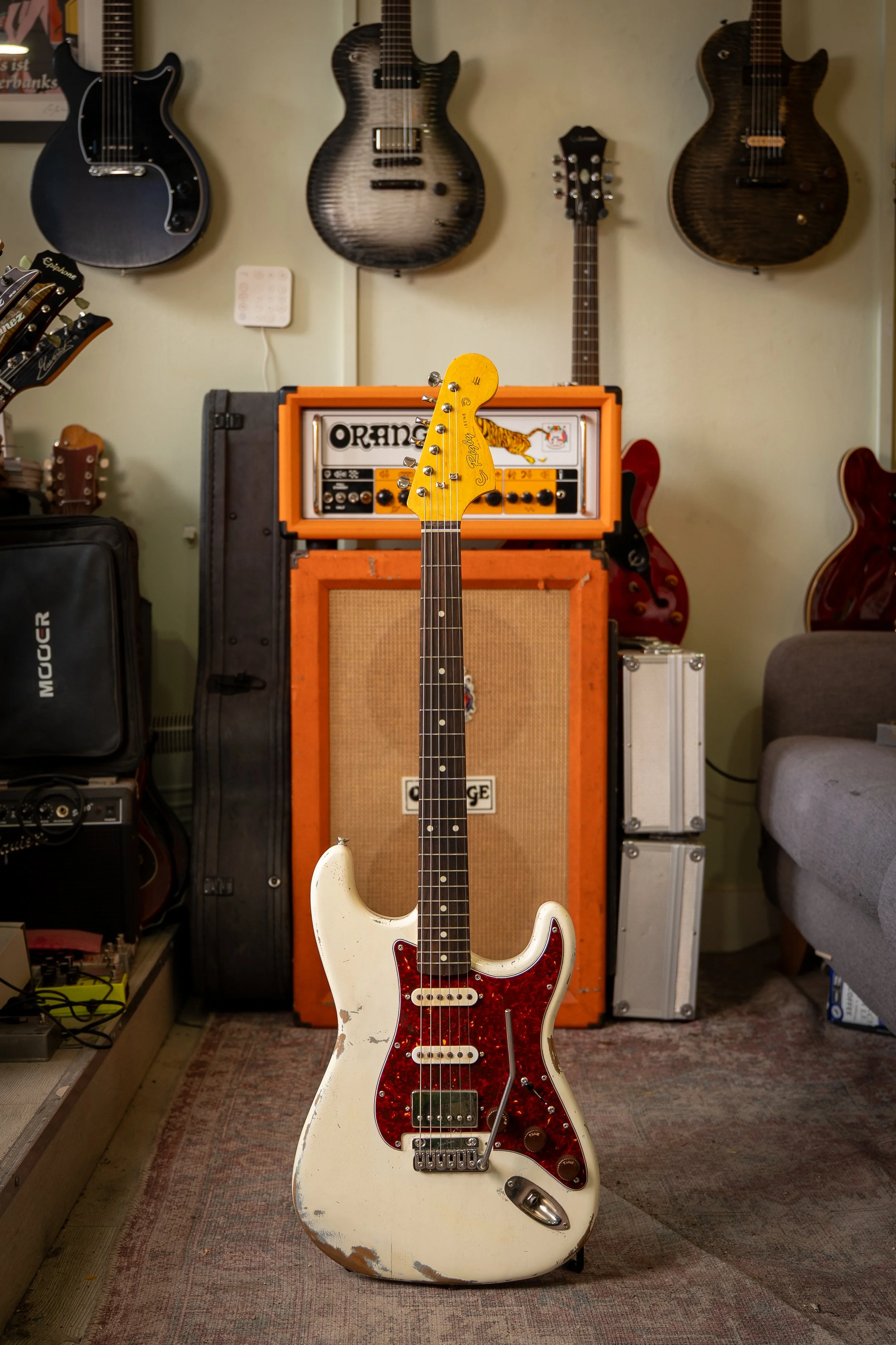 white reliced HSS Stratocaster, white pickups with black humbucker, tortise shell pickguard