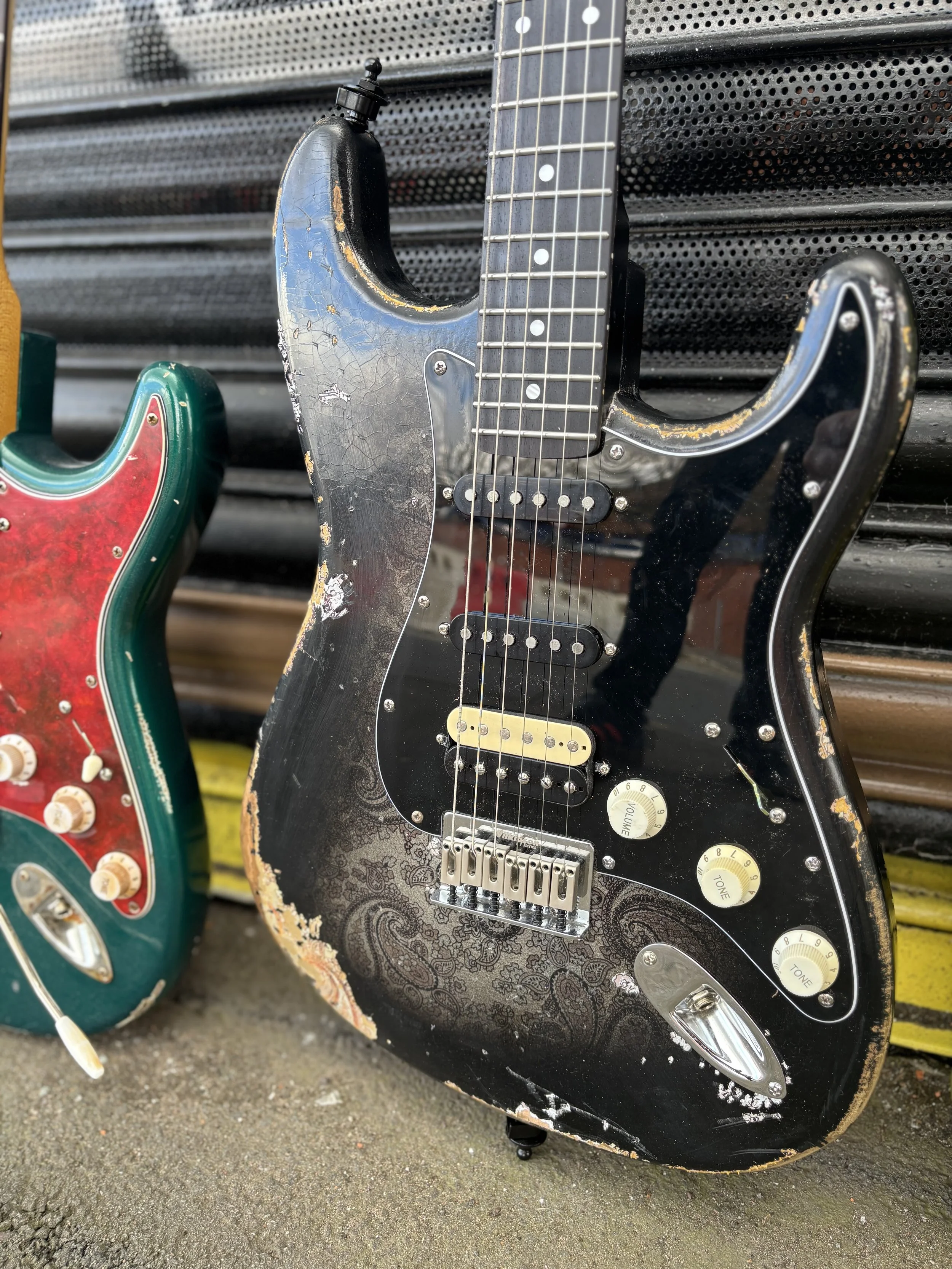 black, heavy relic HSS stratocaster, black pickguard , white control knobs 