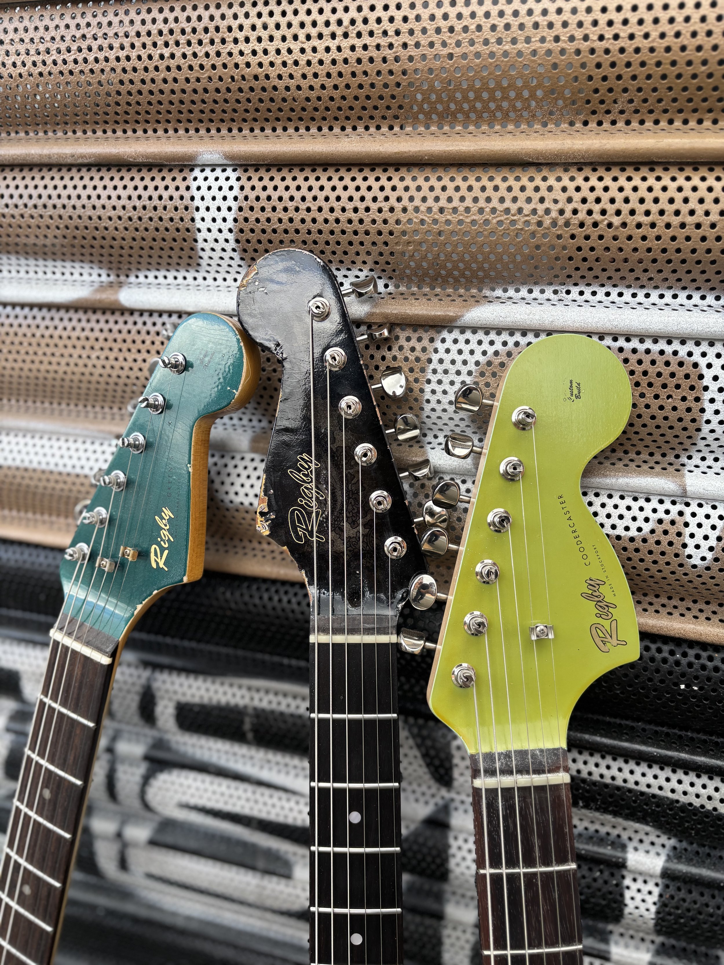 marching headstocks for three strats, dark green, light green and black