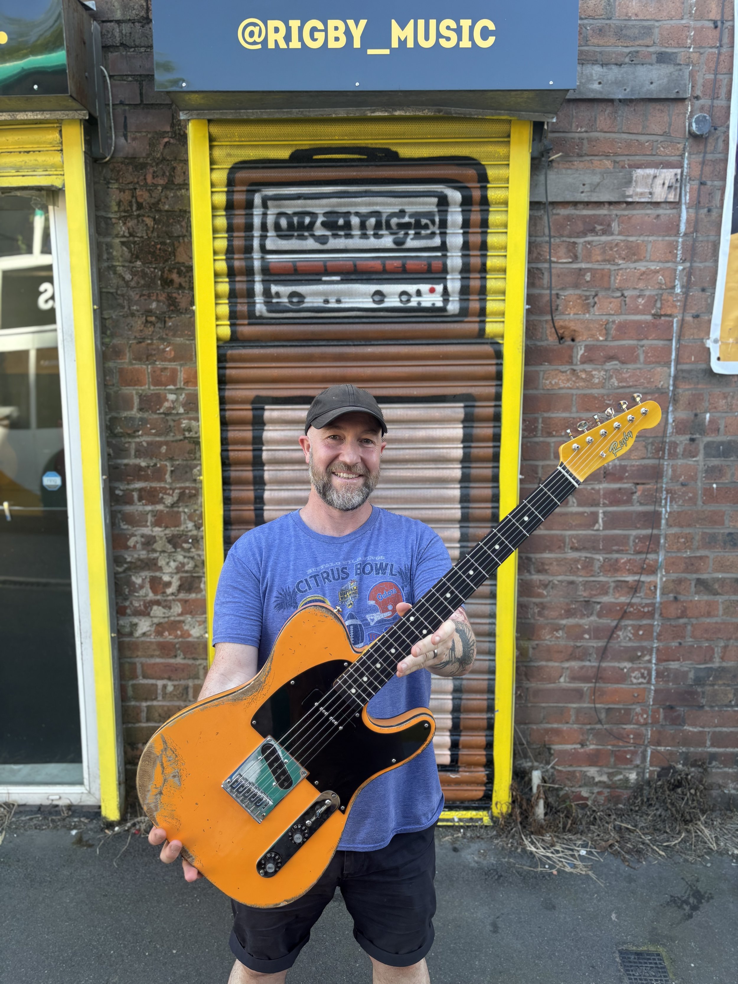 happy customer, orange reliced telecaster, black pickguard, maple neck, 