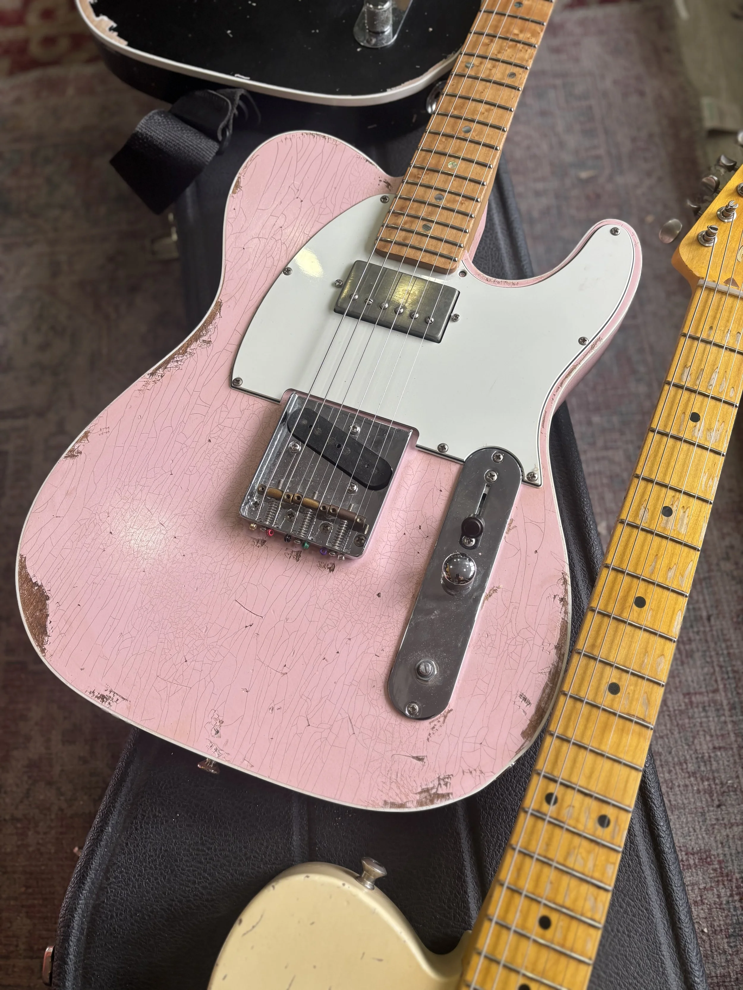 Pink Custom Classic Telecaster, white pickguard, maple neck and humbucker bridge pickup
