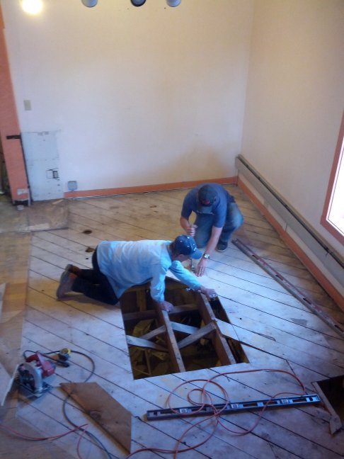Installation of the trap door leading to the basement