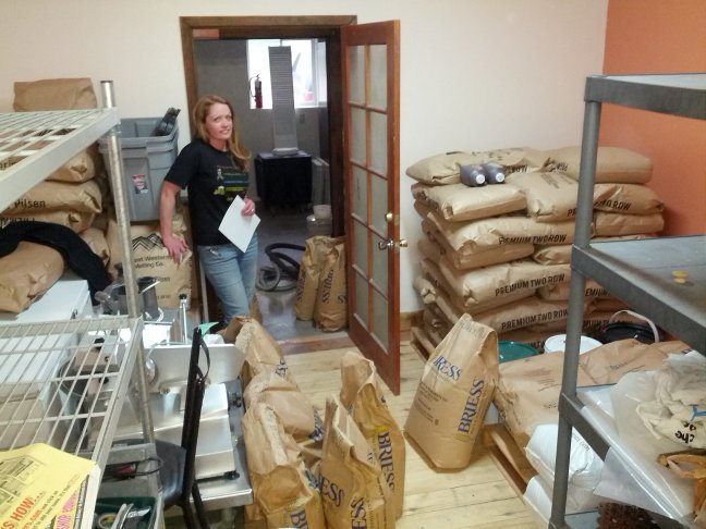 Founder, Eleanor organizing the grain room, which is now the Stepchild Room