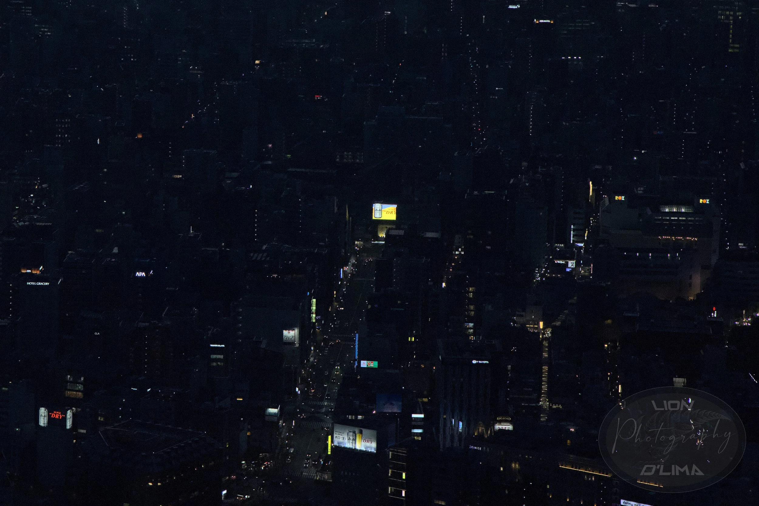 Tokyo Skytree night shot of street traffic and giant screen