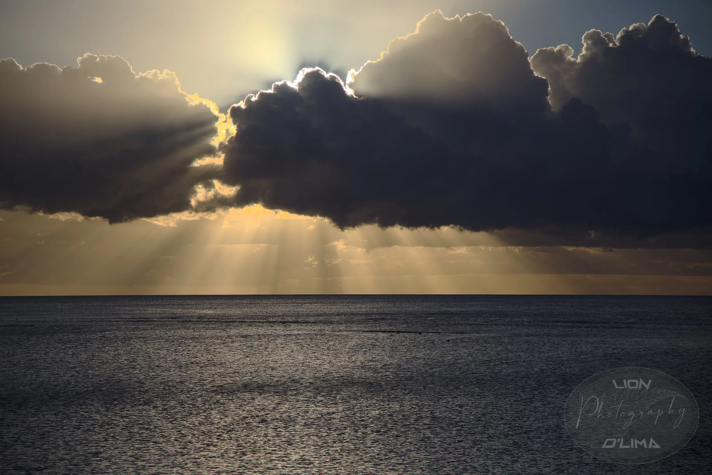 Magical solar glow protruding from clouds
