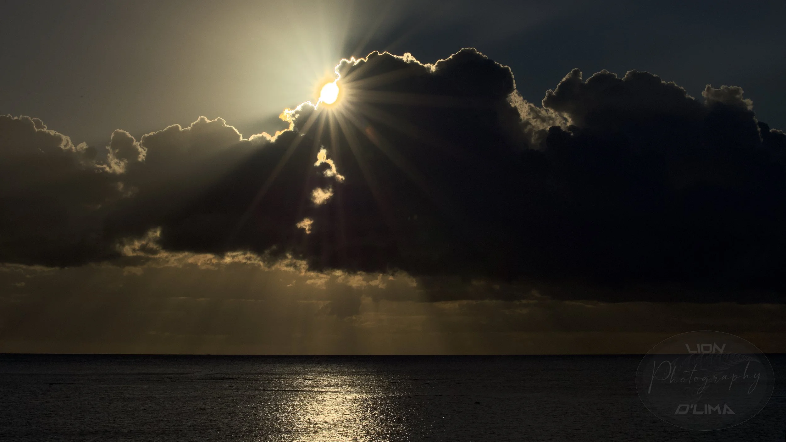 Arty Solar Flare emerging from a cloud with a silver lining - Mauritius