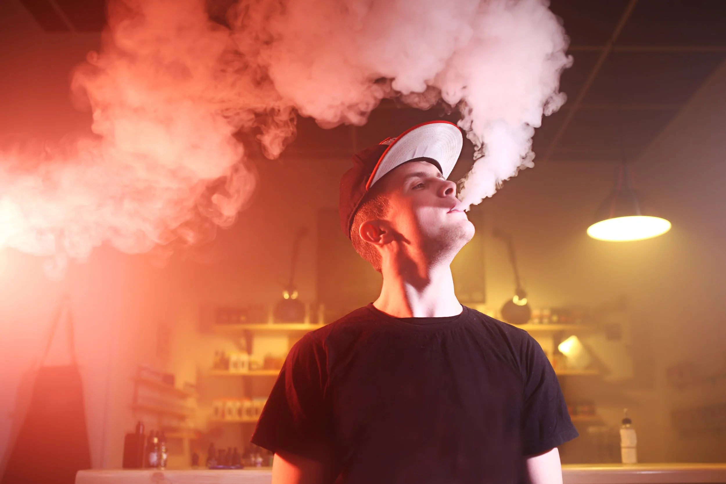 vaping-man-in-a-cloud-of-vapor-in-a-vape-bar-2022-01-17-16-24-33-utc.jpg