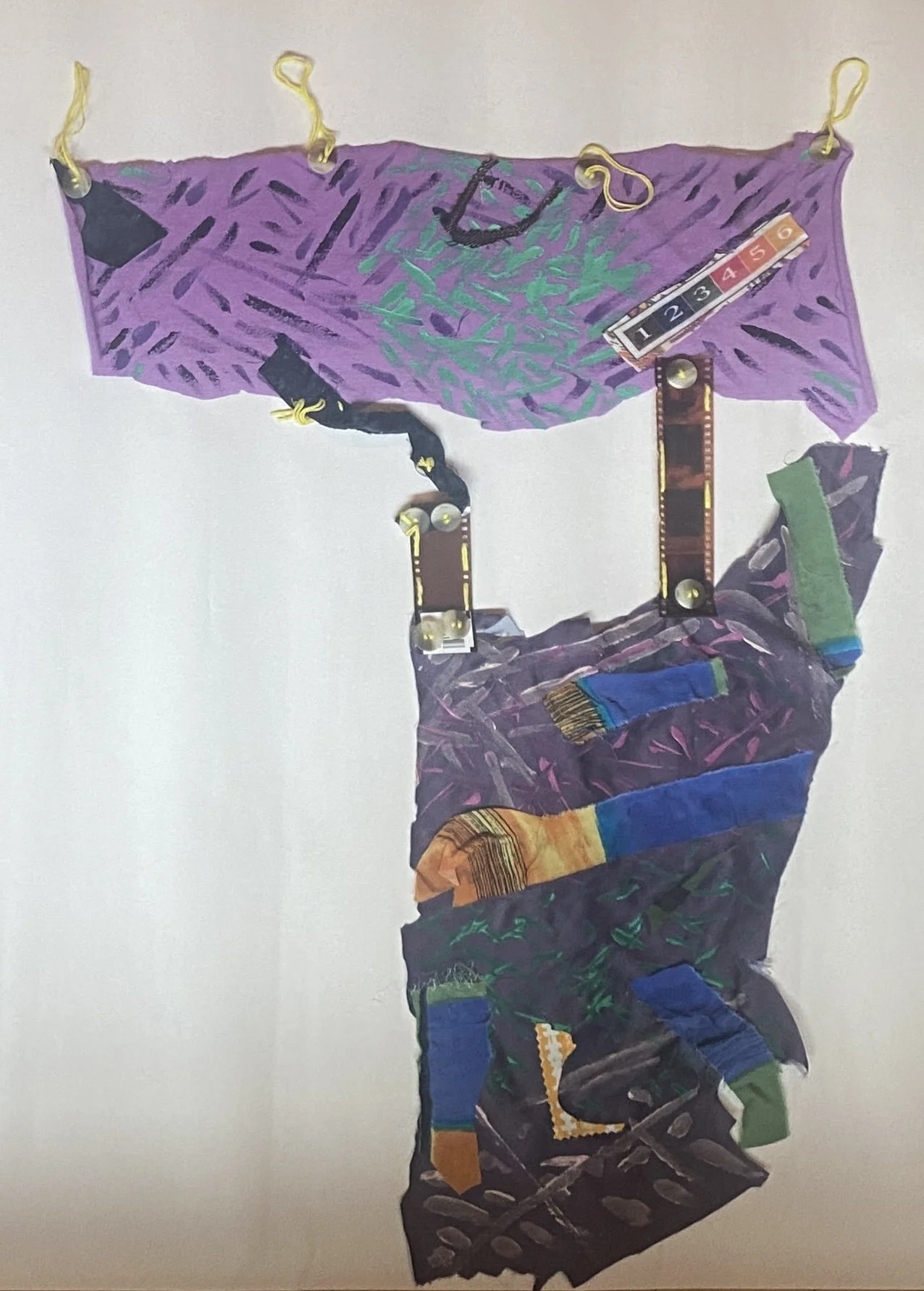 Spinning Tales #4 (Series), 2023. Acrylic paint, recycled fabric and buttons, embroidery floss, and film negatives, 18" x 27".