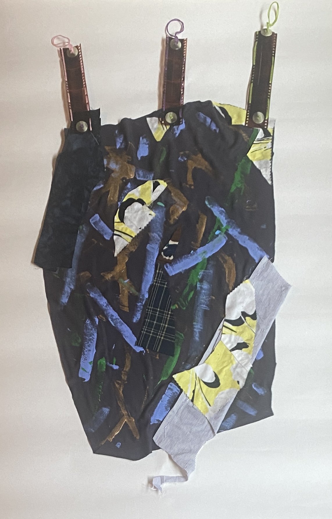 Spinning Tales #9 (Series), 2023. Acrylic paint, recycled fabric and buttons, embroidery floss, and film negatives, 14" x 29".