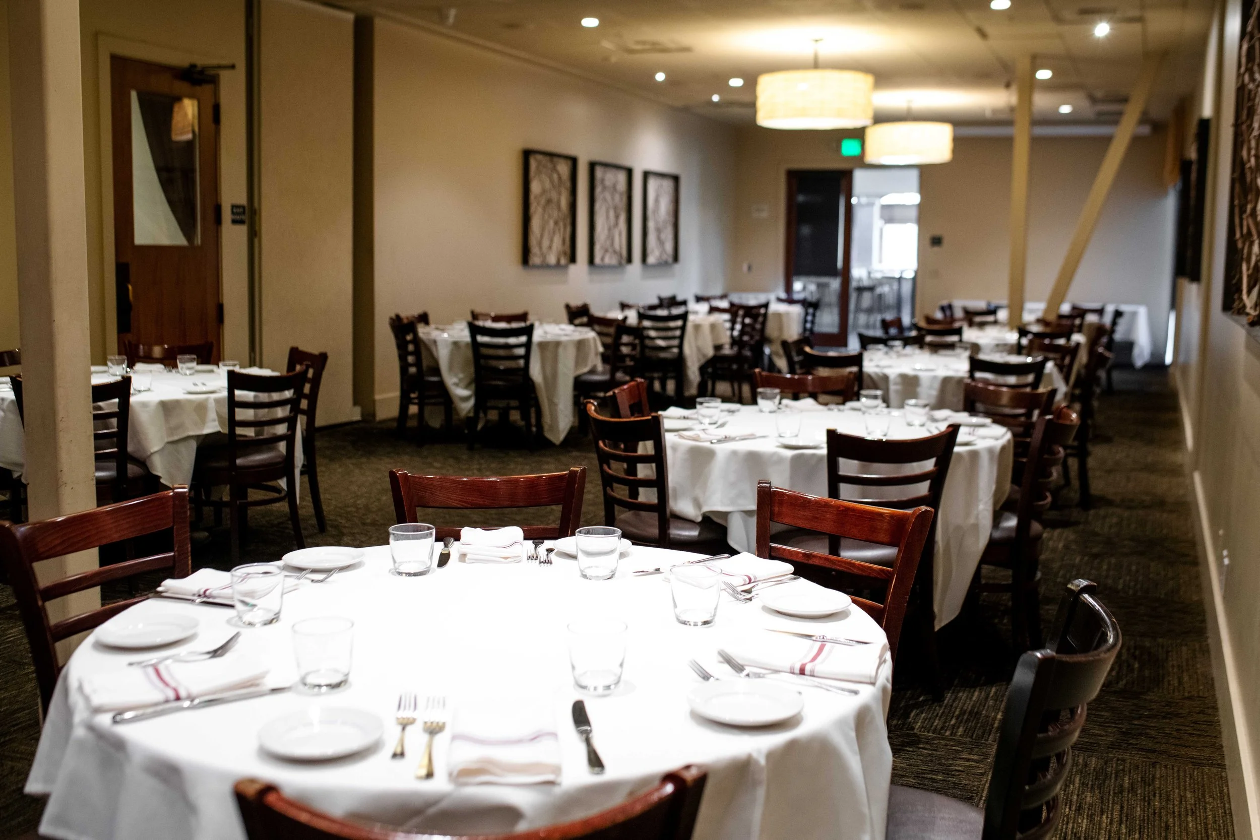 round tables set up in the full tuscan room