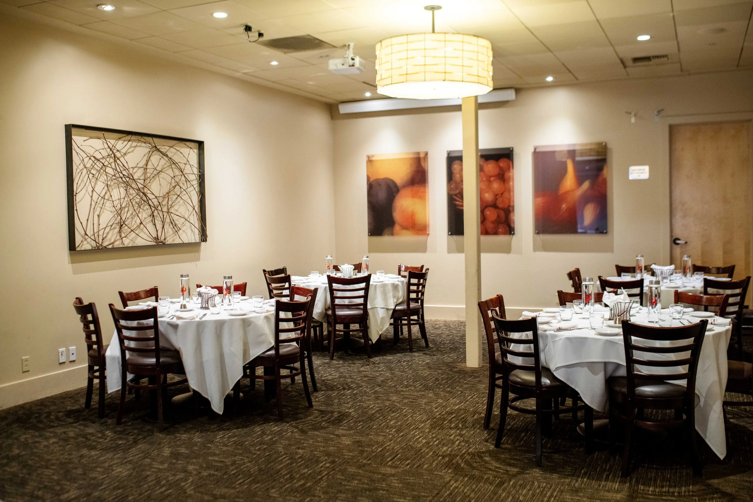 round tables set up in the back tuscan room