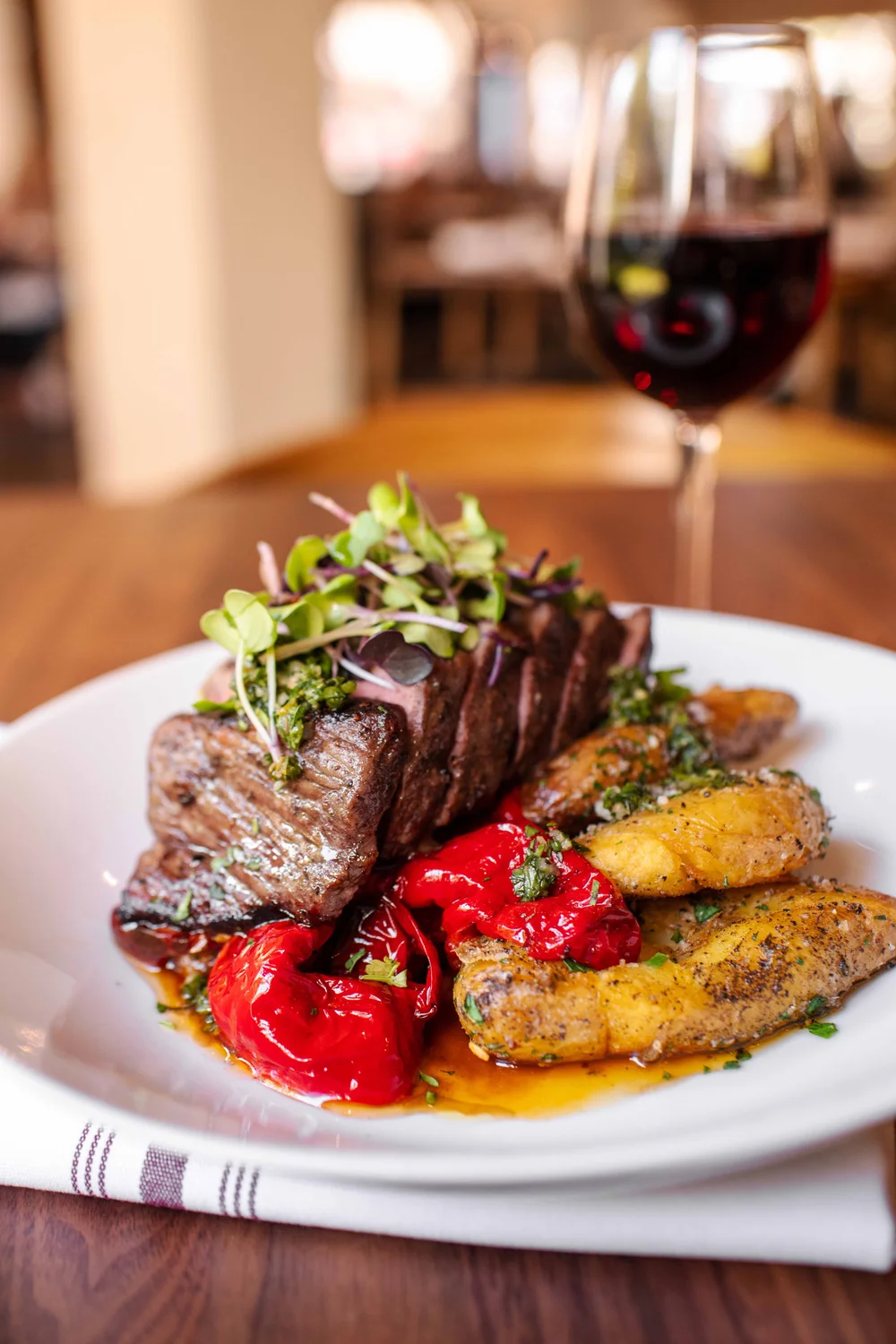 Grilled steak with a glass of red wine at Piatti Sacramento