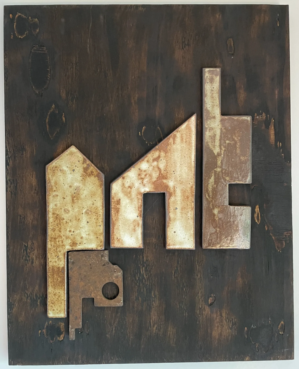 The charred wood meets metal shapes, this piece holds weight beautifully 